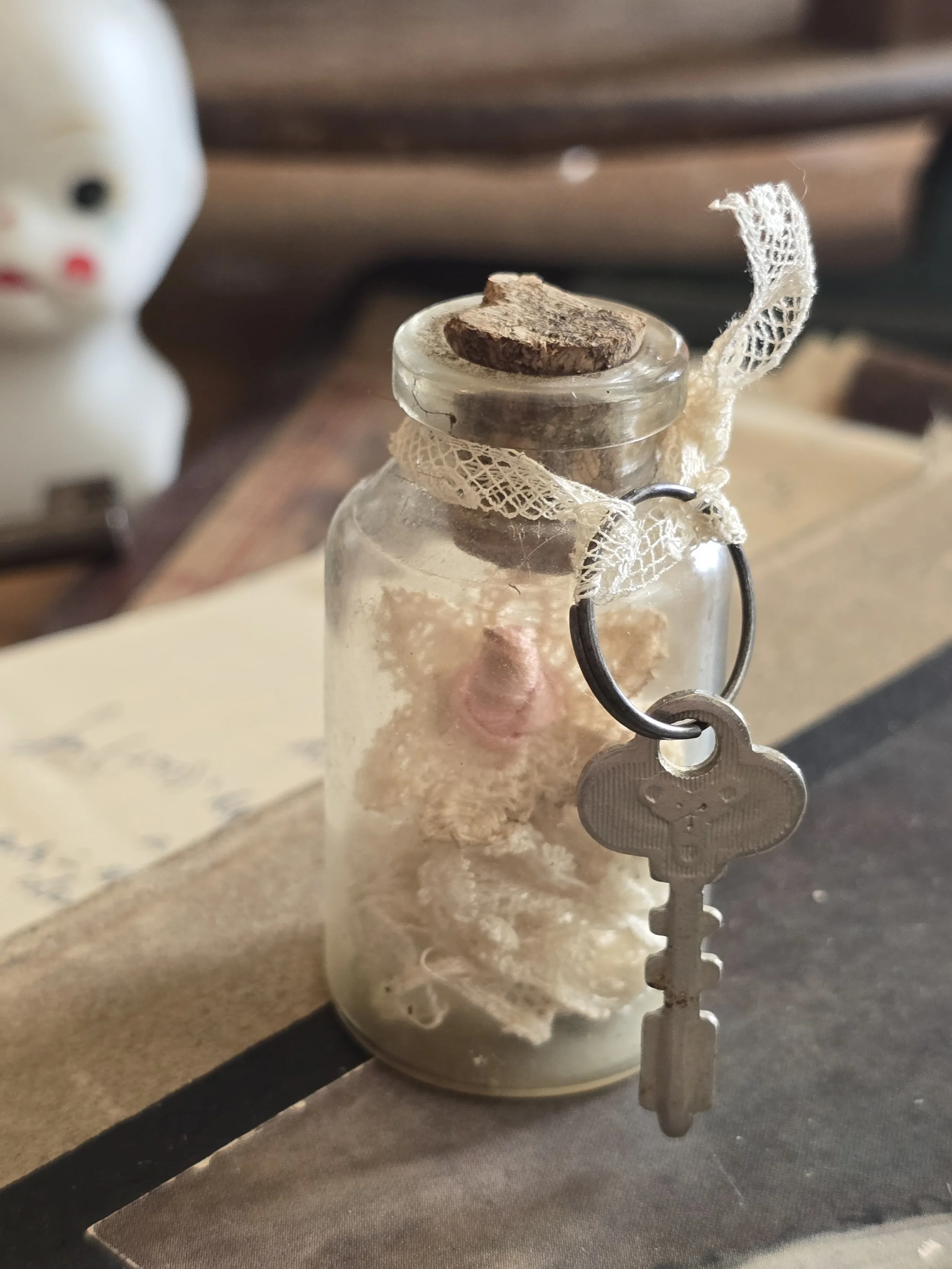 Found object artwork with antique lace and old key