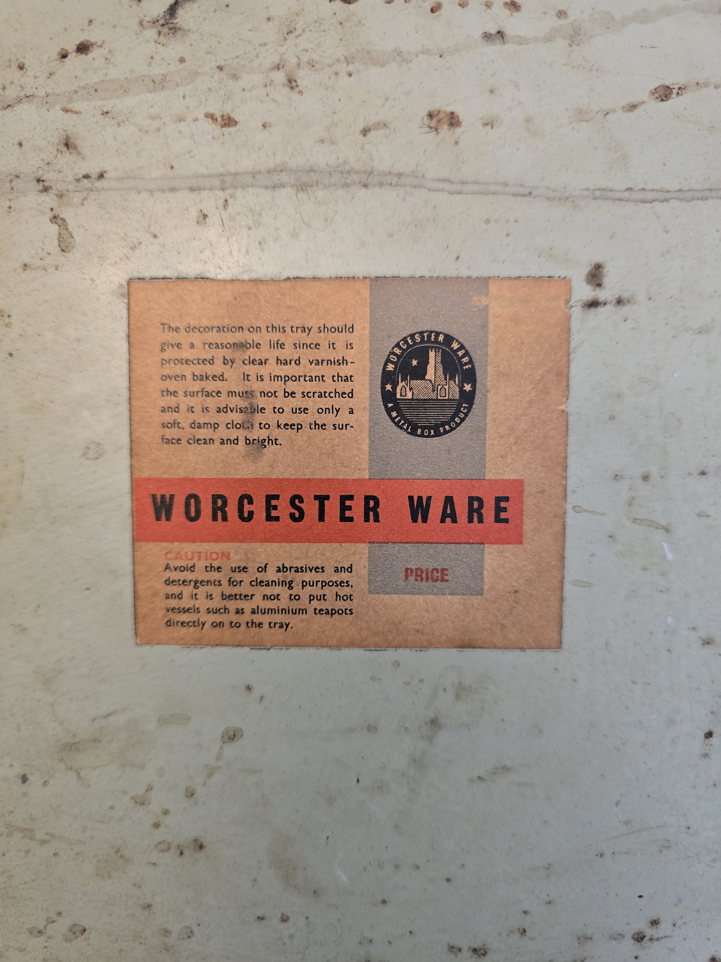 Underside of vintage folding bed tray showing metal legs and original Worcester Ware label. (Copy)