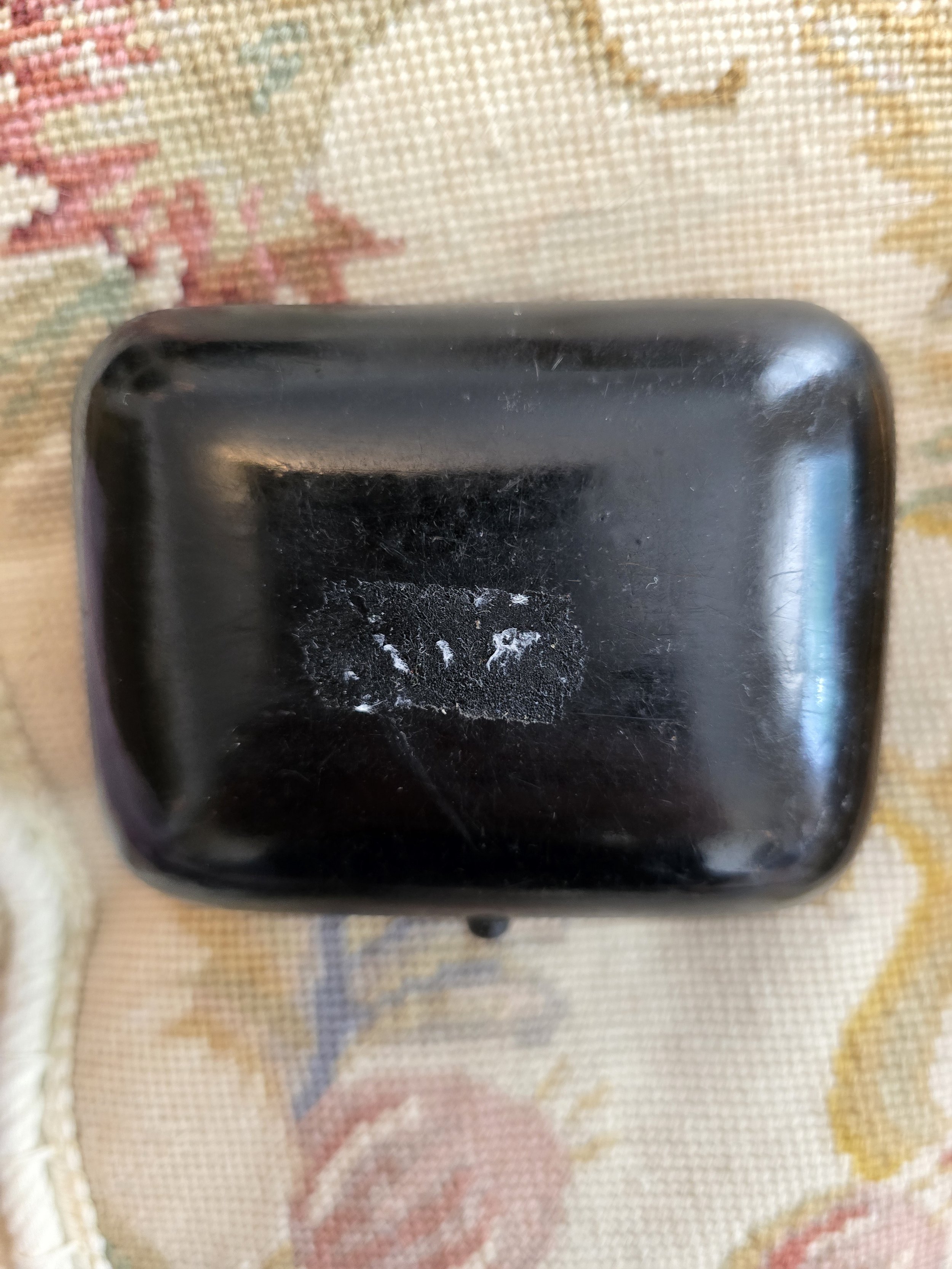 Hand-painted daisy keepsake box with floral decoration on black ground