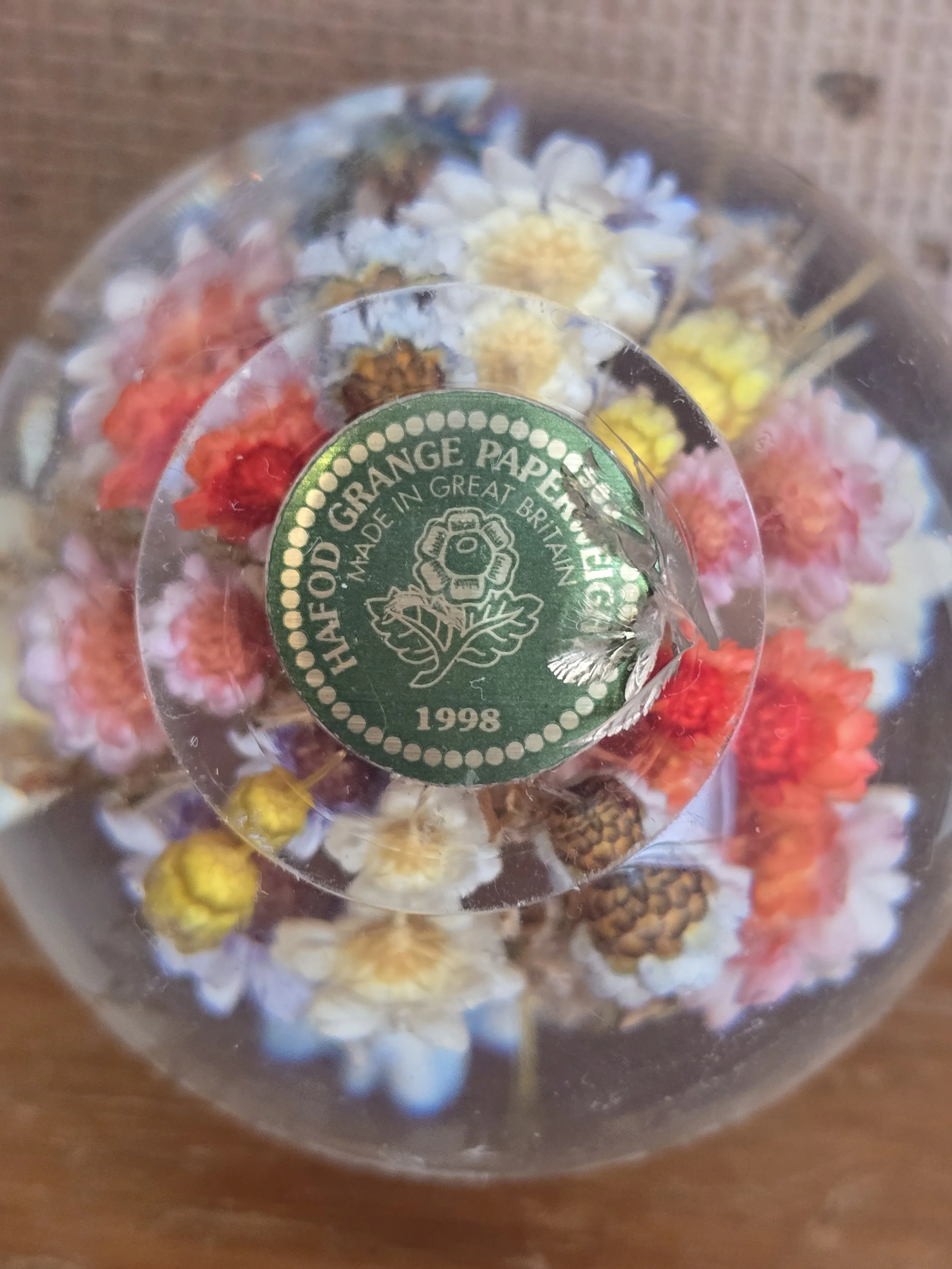 Base of vintage Hanford Grange paperweight showing original 1998 maker's label.