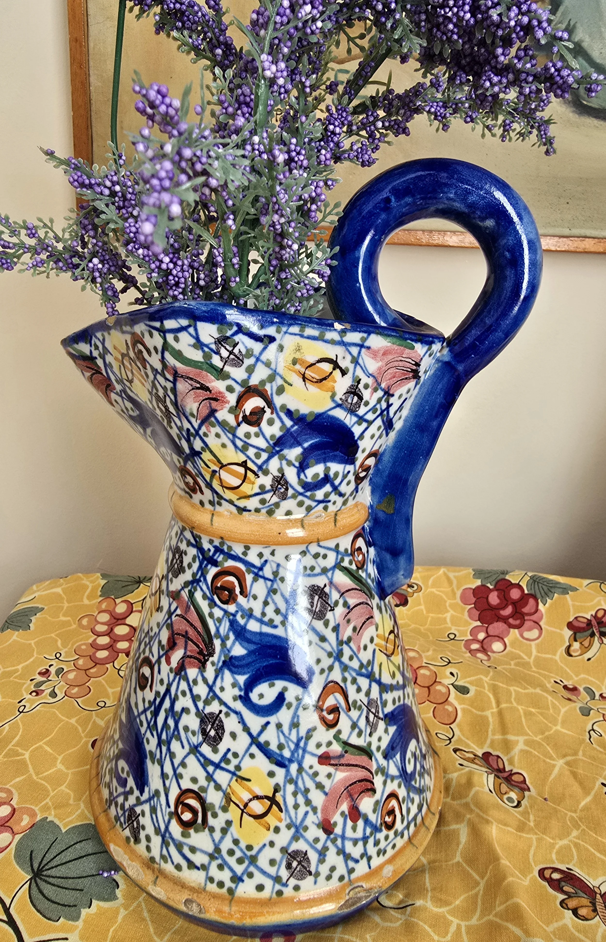 Full view of vintage abstract ceramic pitcher with cobalt handle