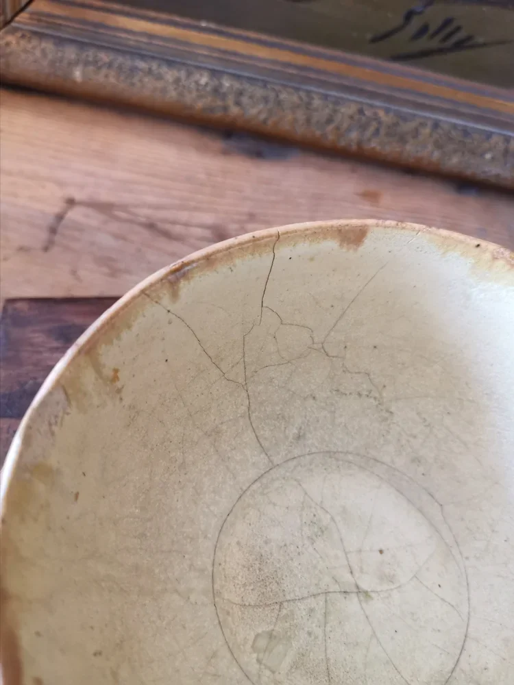 Interior and rim detail of antique ceramic sugar bowl with crackle glaze