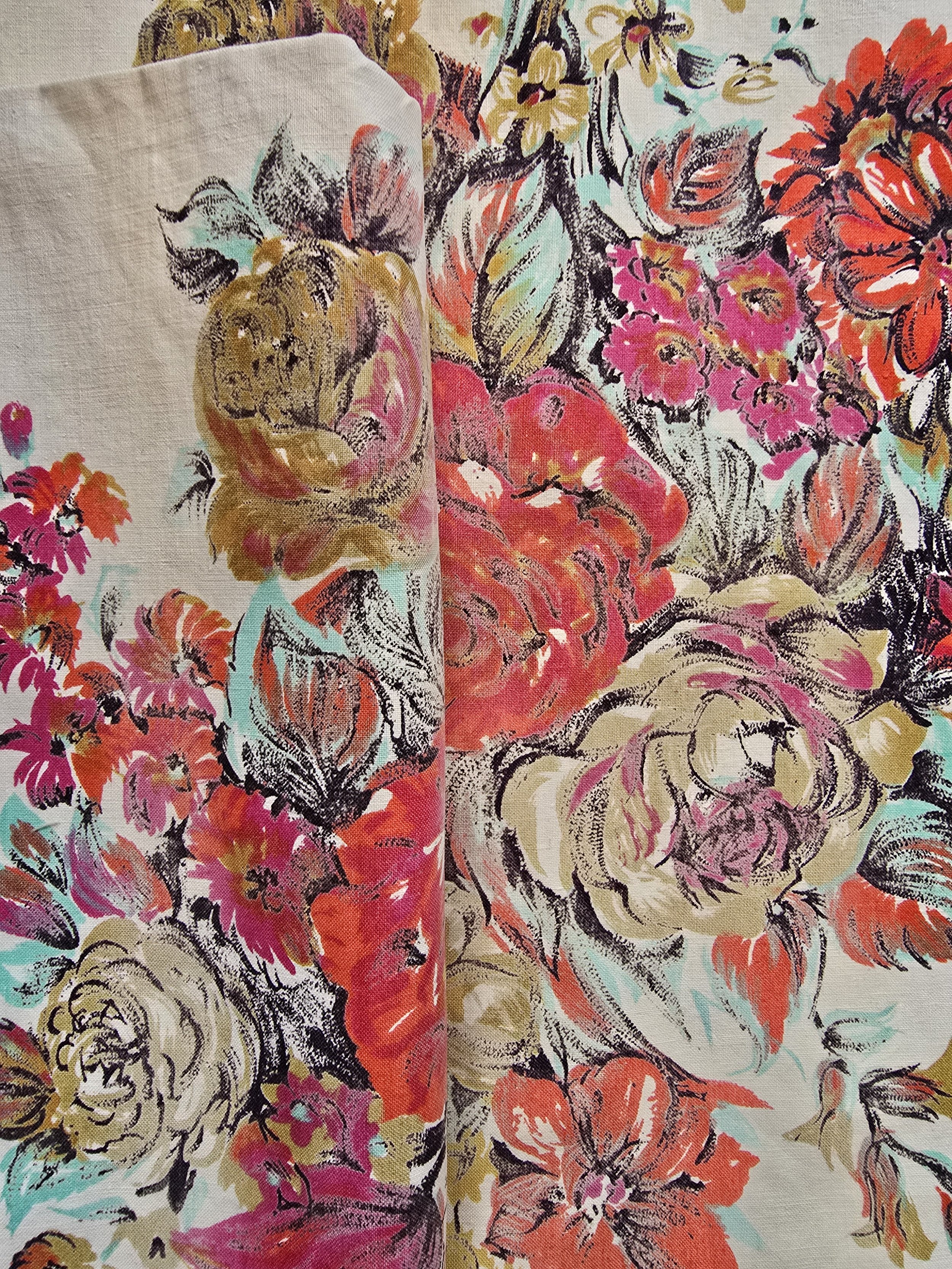 Close-up of vintage fabric showing rescued floral texture and print