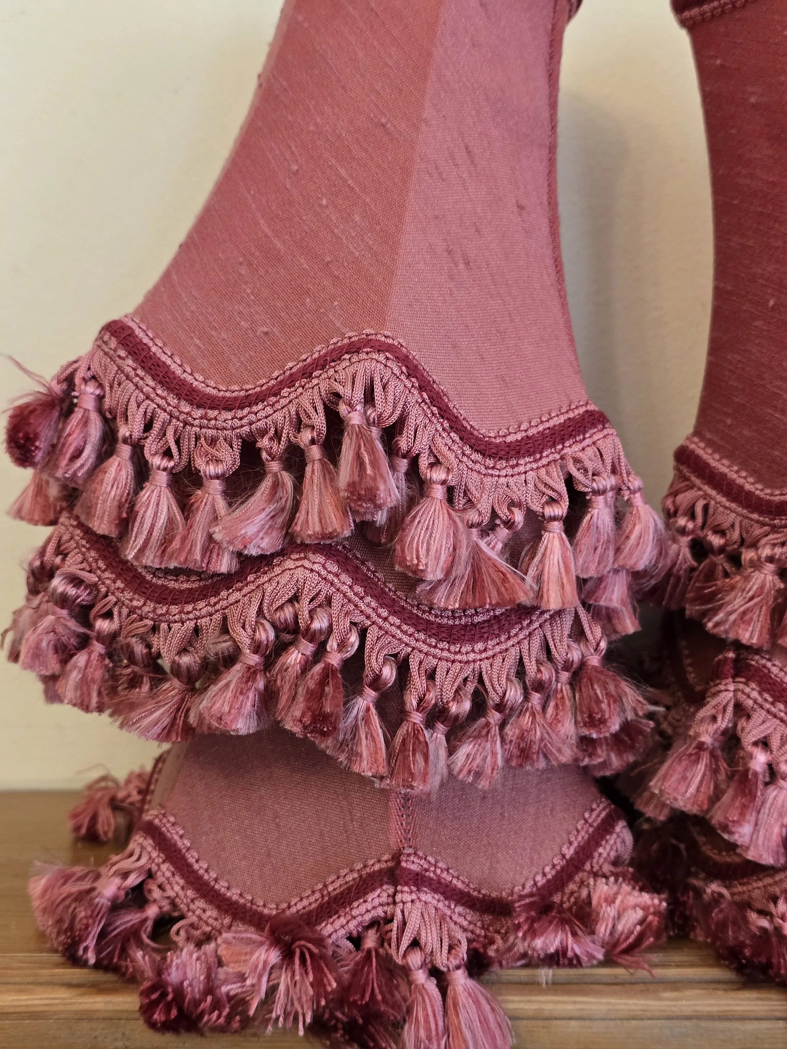 French style pink lampshade with decorative passementerie tassels.