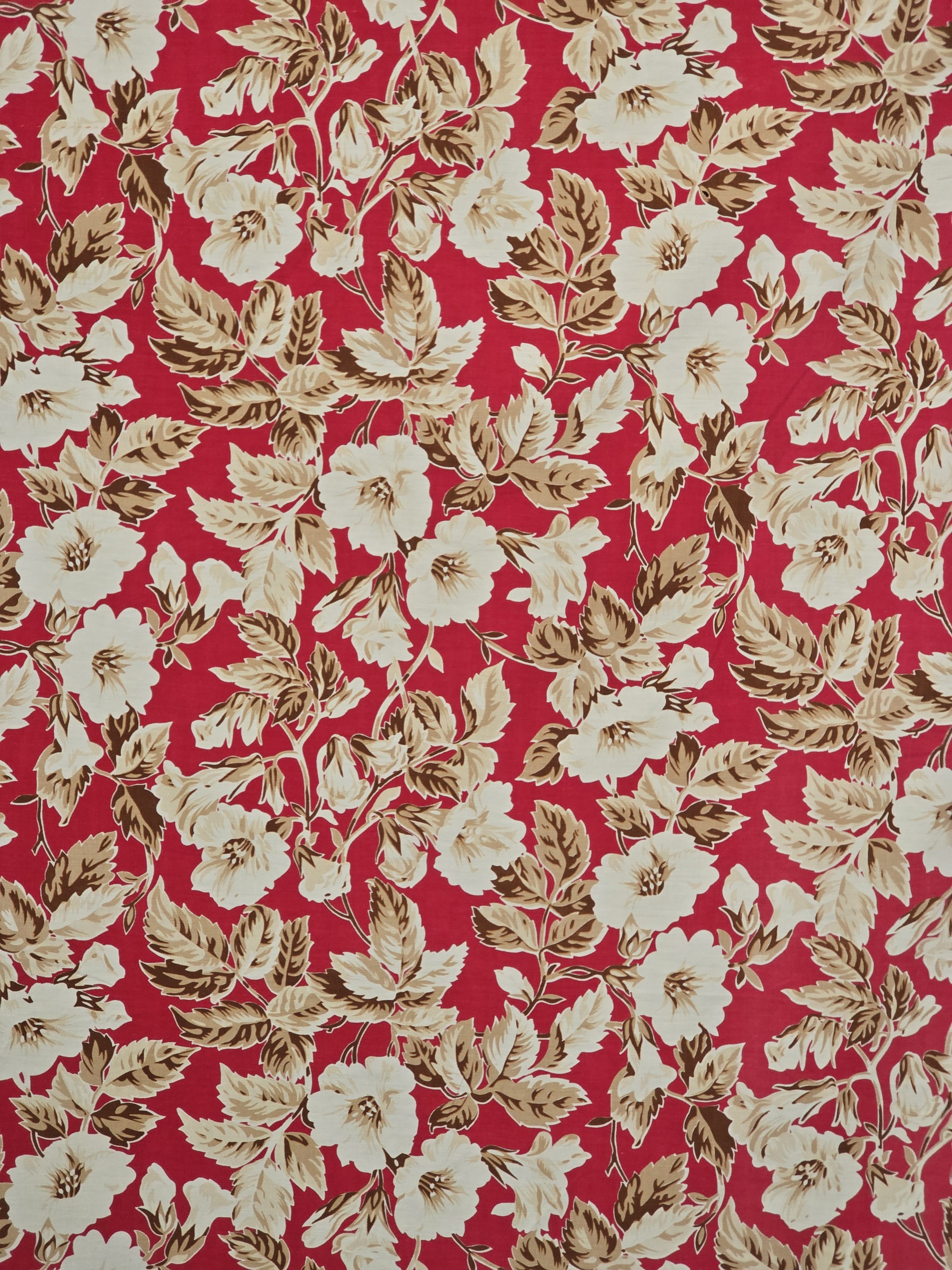 Close-up of vintage floral furnishing fabric showing detailed blossom print