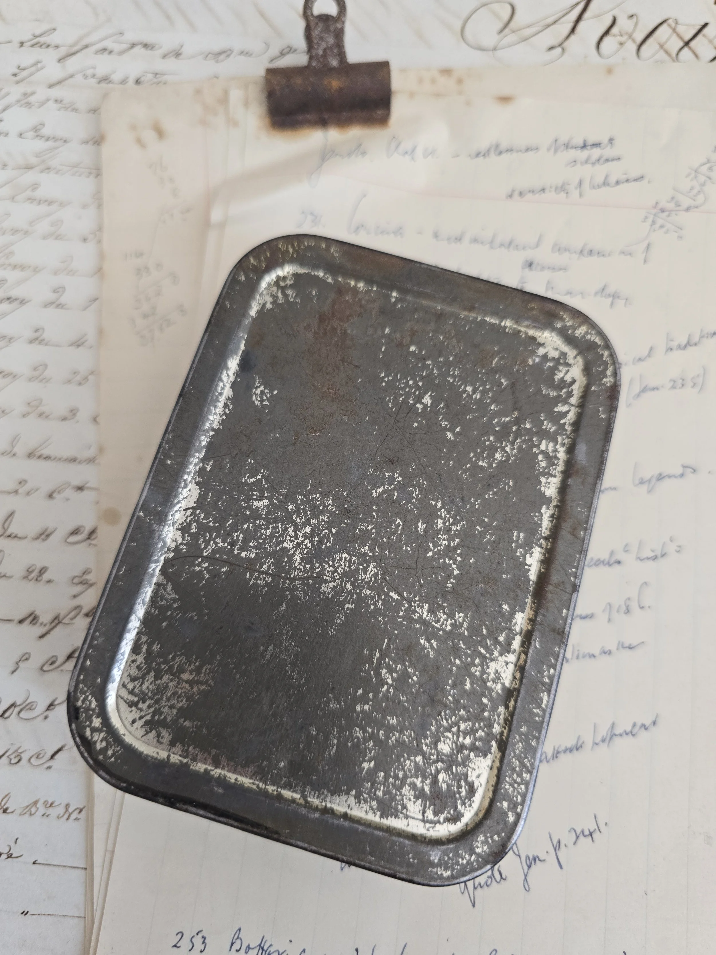 Reverse of reclaimed vintage metal tin showing original age and patina.