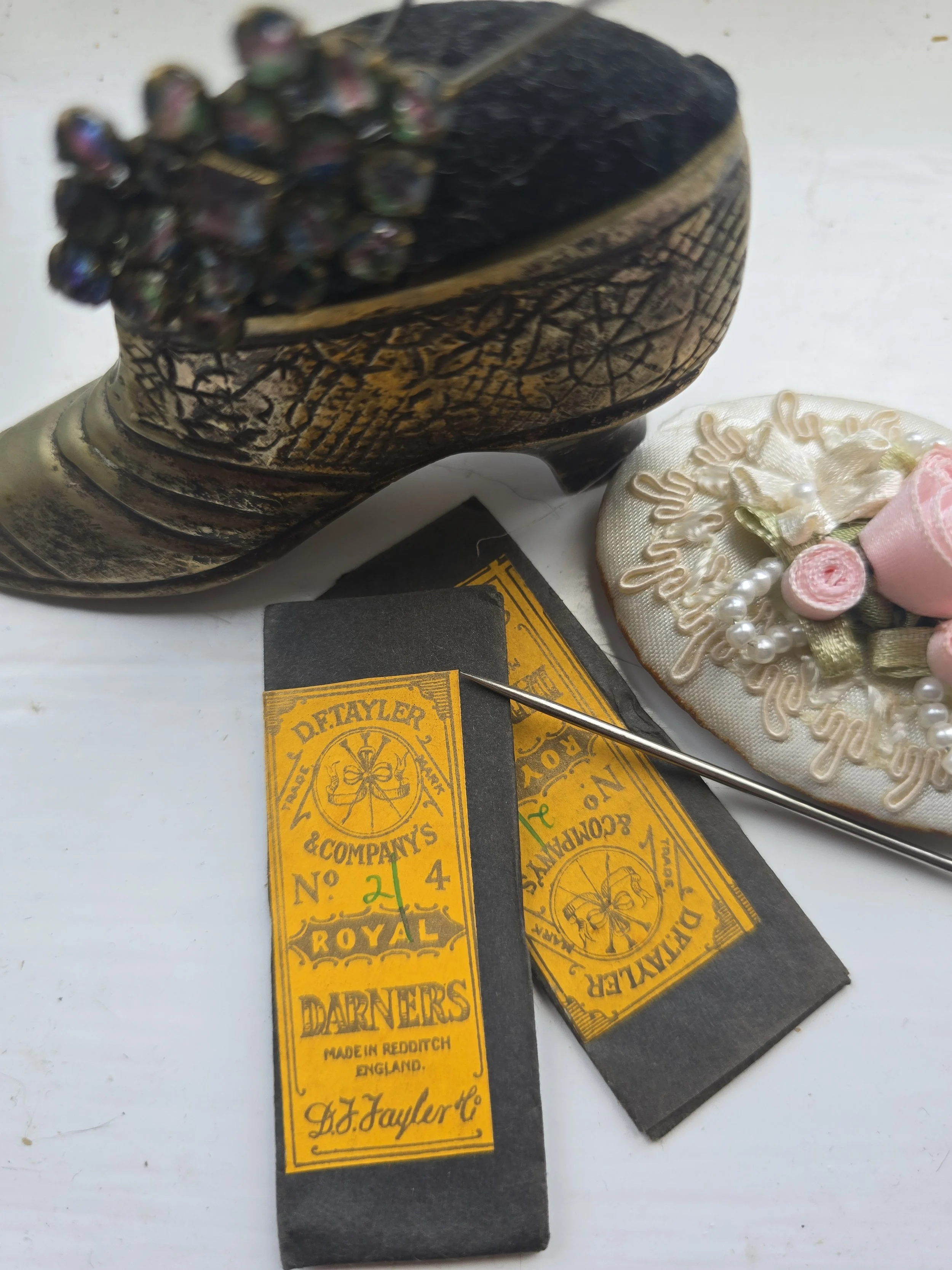 Original D.F. Tayler & Co Royal Darners No. 24 needle packet with yellow printed label and black paper wrapper, made in Redditch, England.