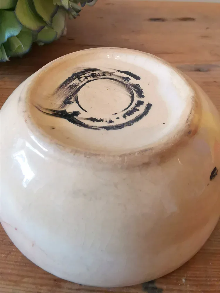 Close-up of hand-painted design on vintage Tunisian Nabeul ceramic bowl