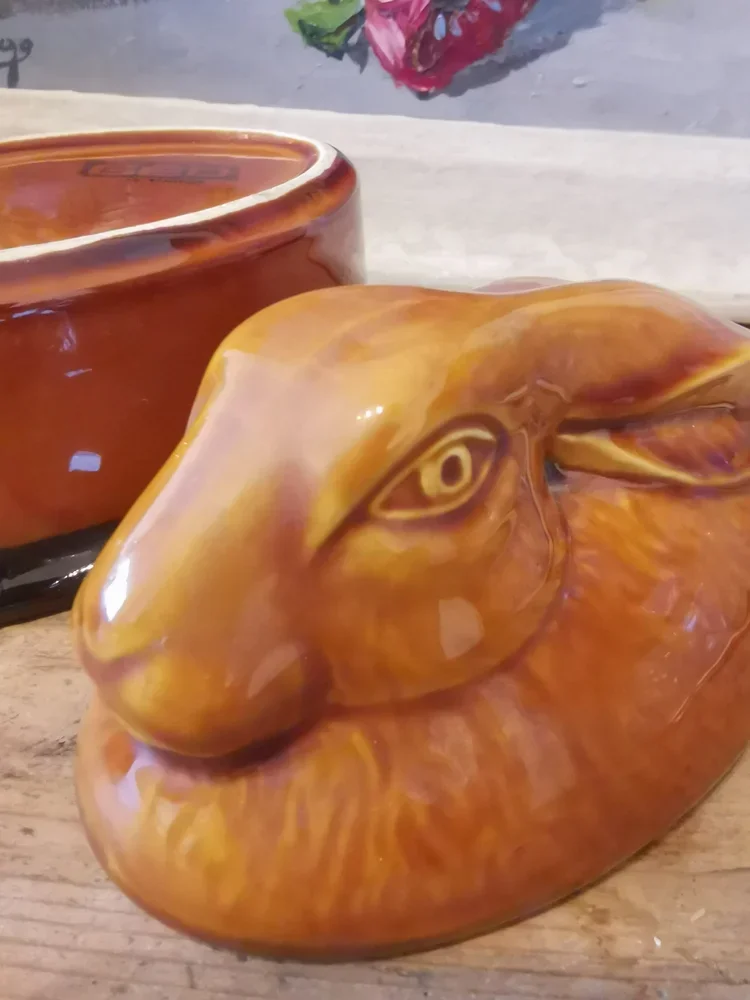 Close-up of rabbit head lid on vintage French terrine