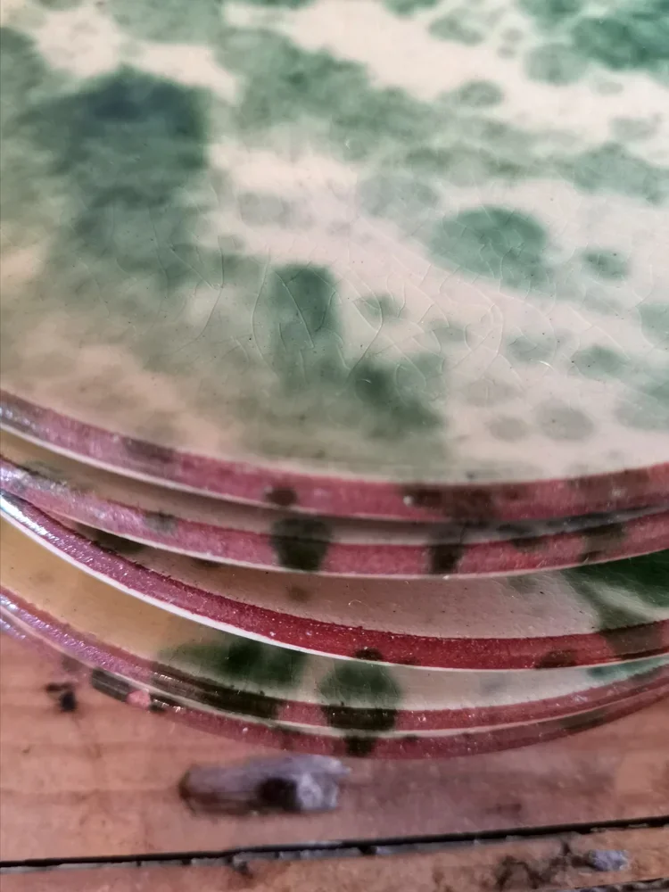 Full stack of 6 rustic French side plates with green jaspé glaze