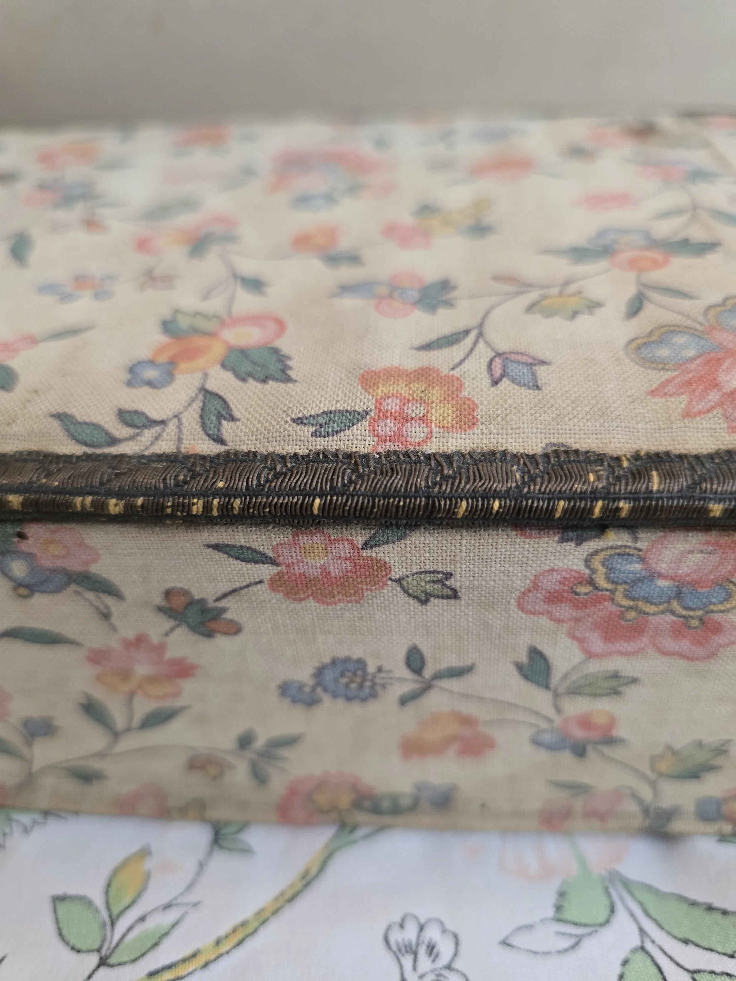 close-up of the worn woven trim showing authentic age and character