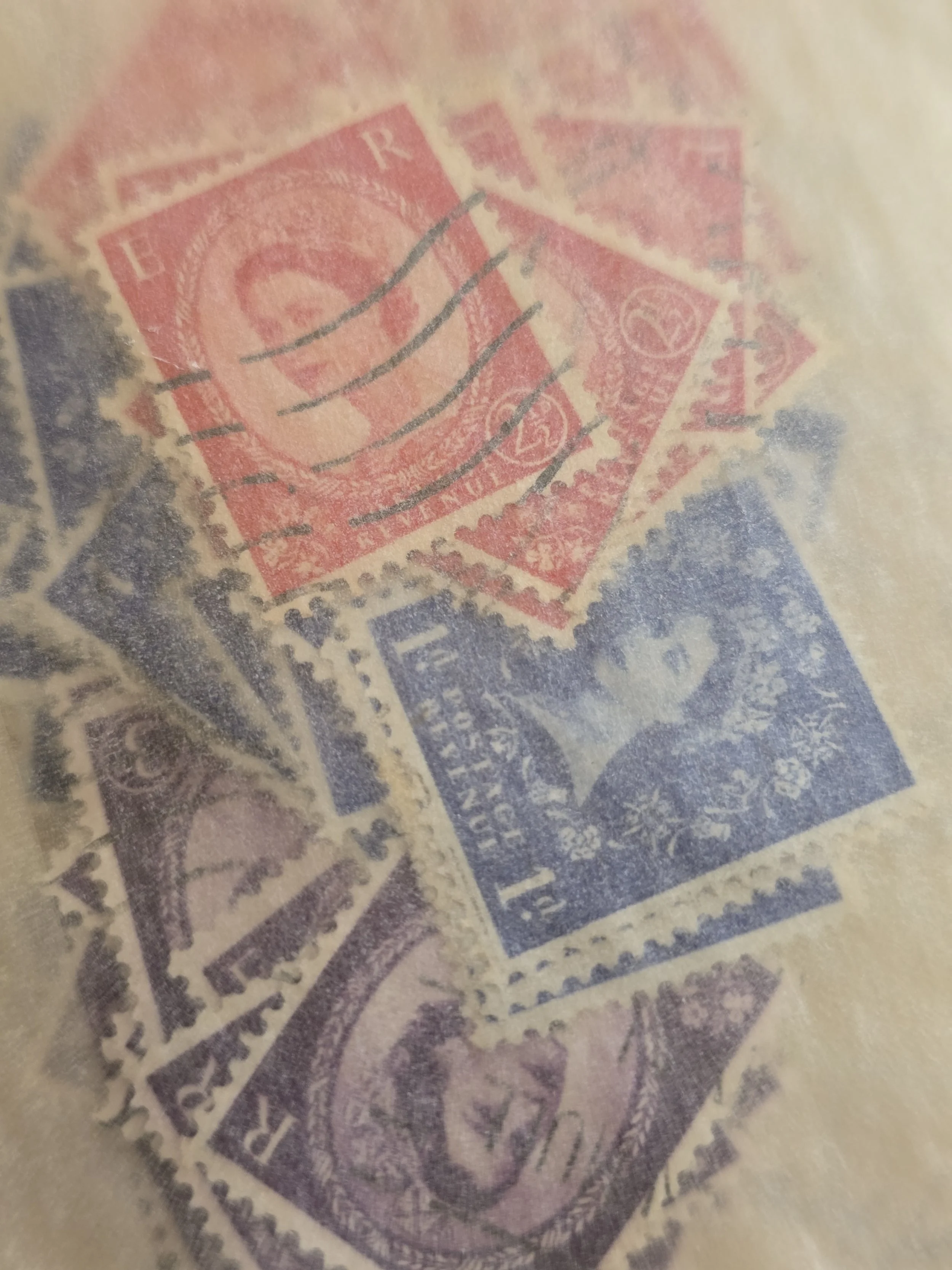 Vintage British stamps in red blue and purple