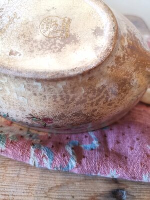 Underside of French ceramic sauce boat showing wear and foot ring details