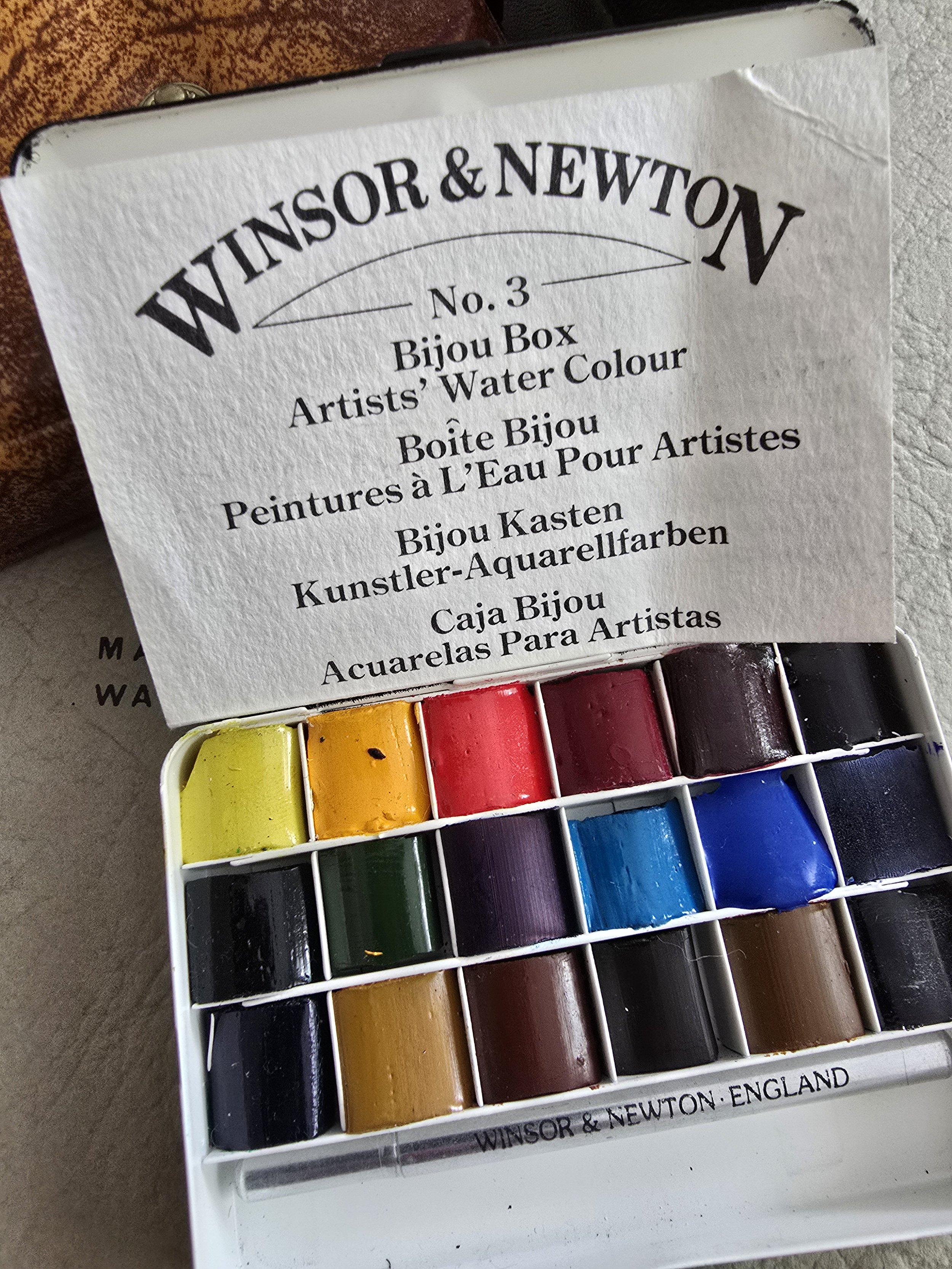 Winsor & Newton No.3 Bijou Box placed over vintage Langton sketchbook