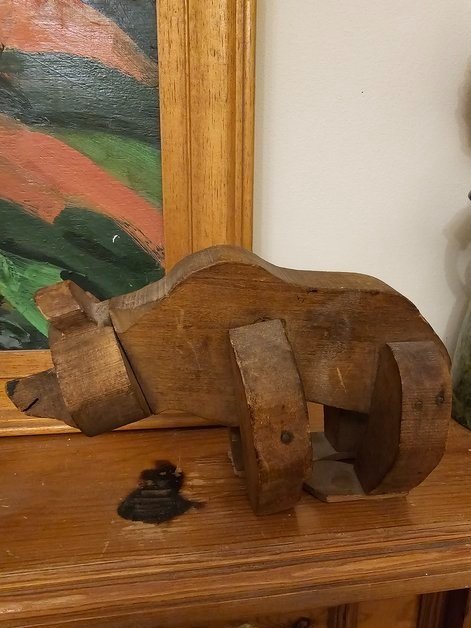 Antique articulated wooden toy bear made by Caran d’Ache, front view showing carved detail