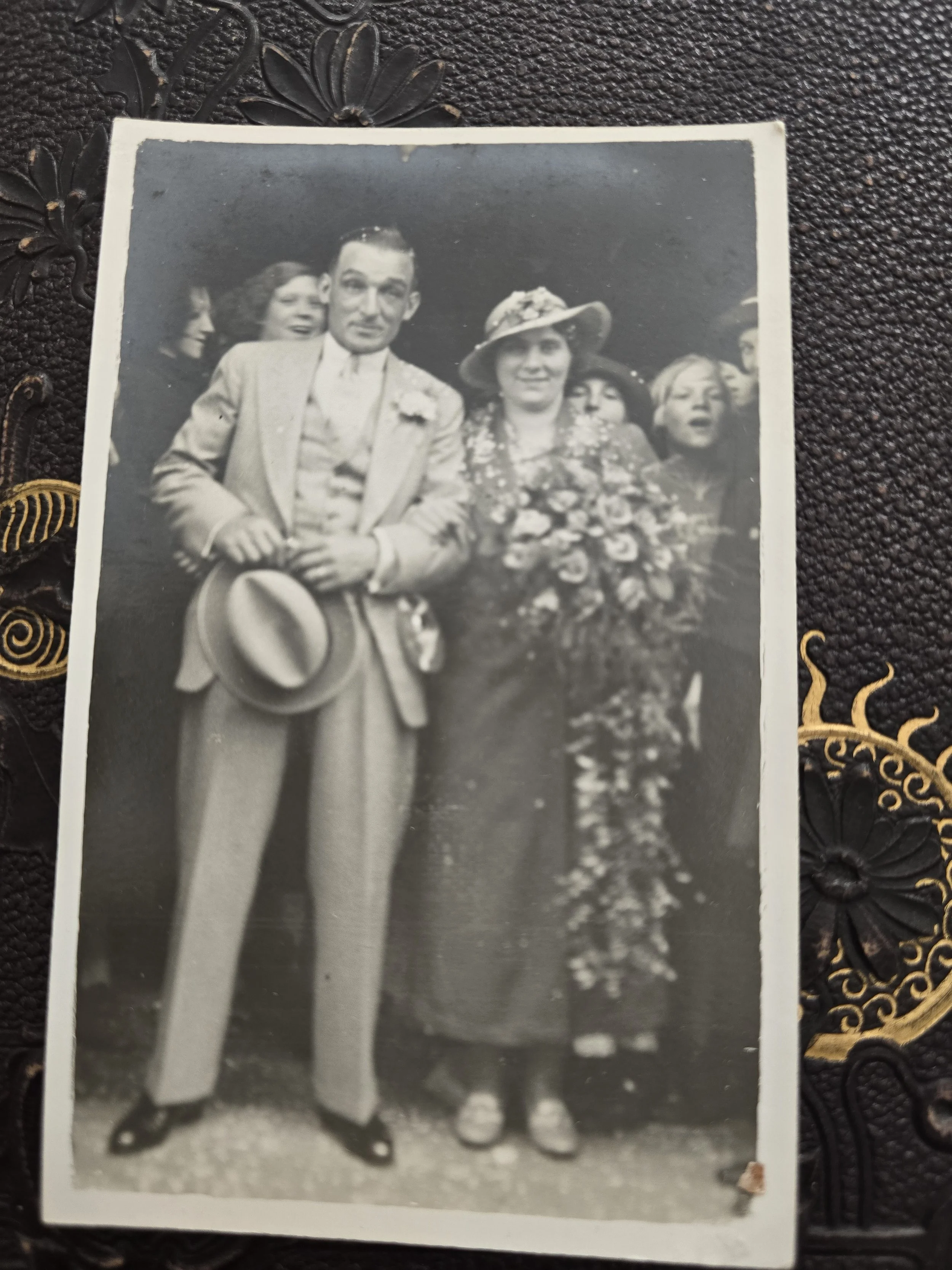 Original 1930s black and white photograph of a formally dressed couple surrounded by a crowd.