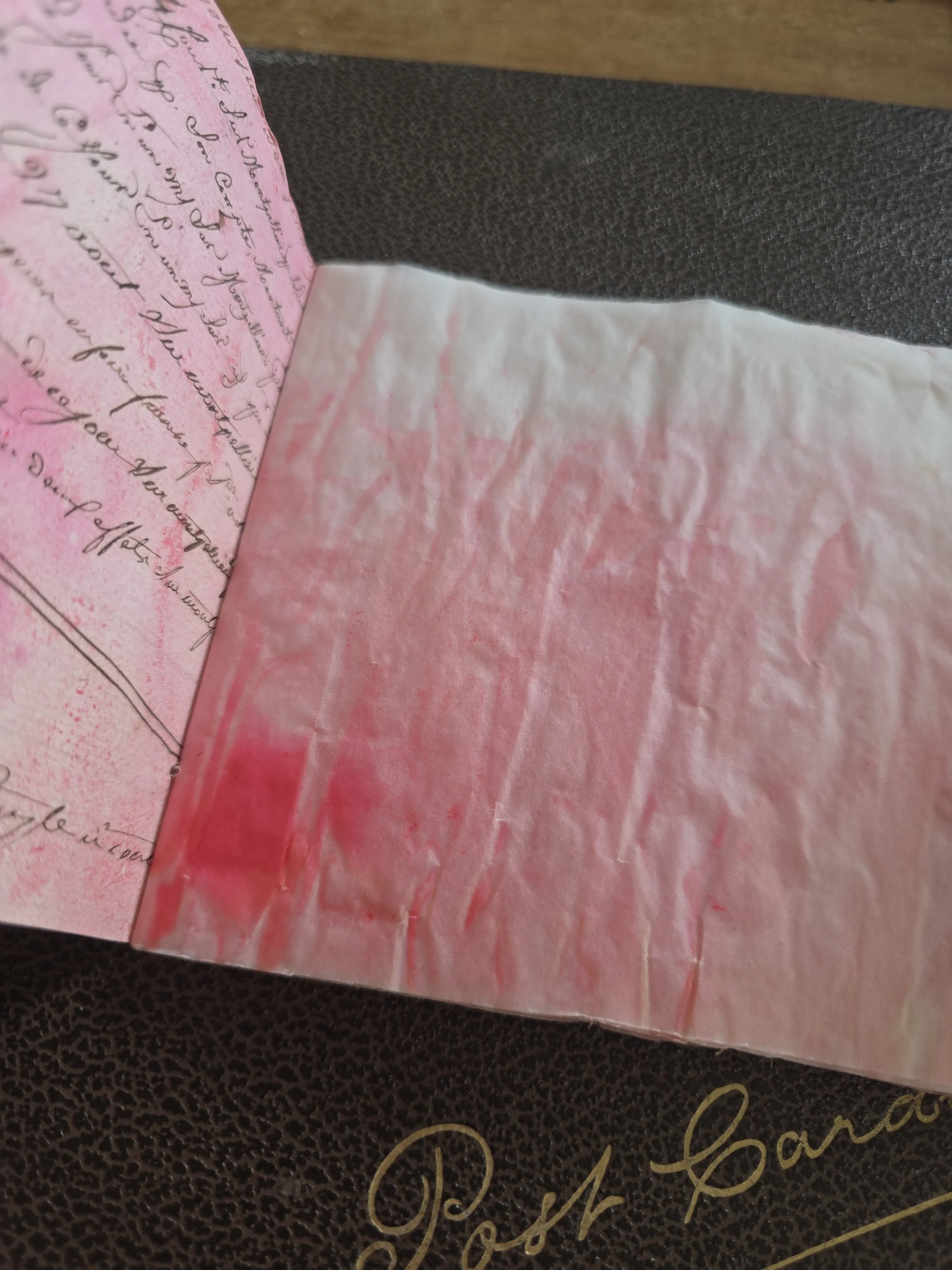 Small handmade artist's journal created from nineteenth century French ledger paper with primitive cat artwork.