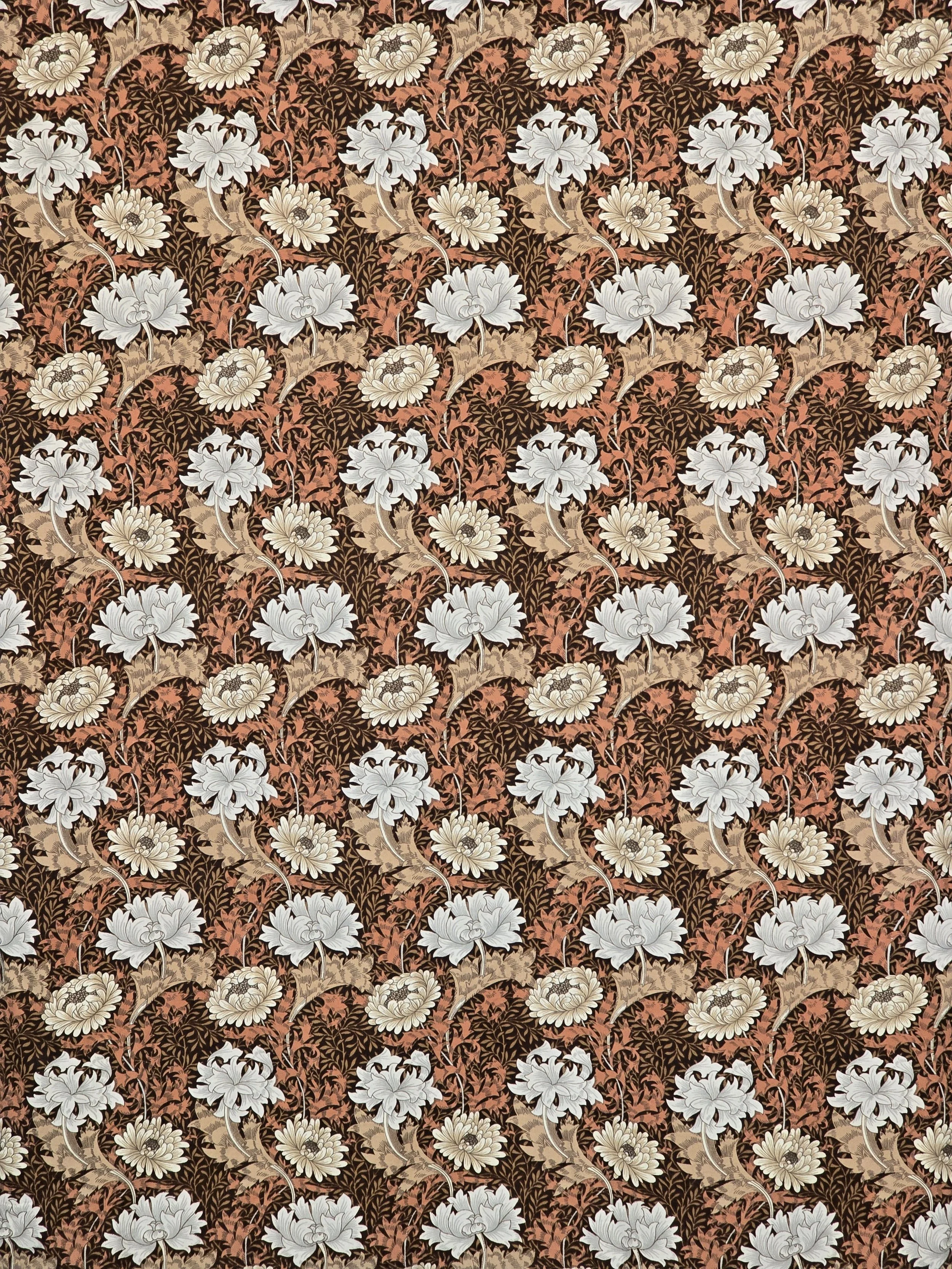 Vintage William Morris textile featuring scrolling botanical motifs and chrysanthemums.