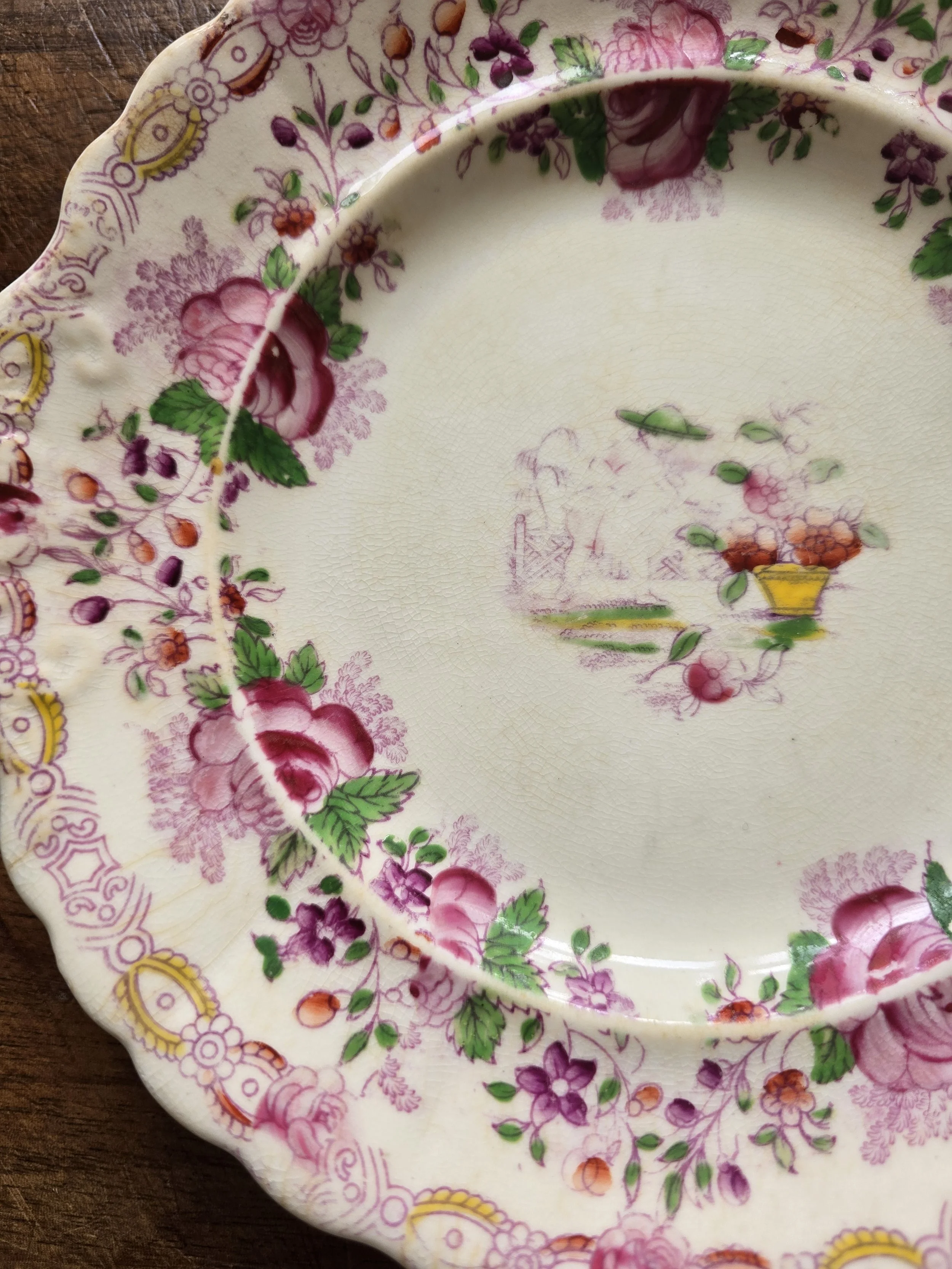 Detail of pink roses and floral transfer print on Victorian plate
