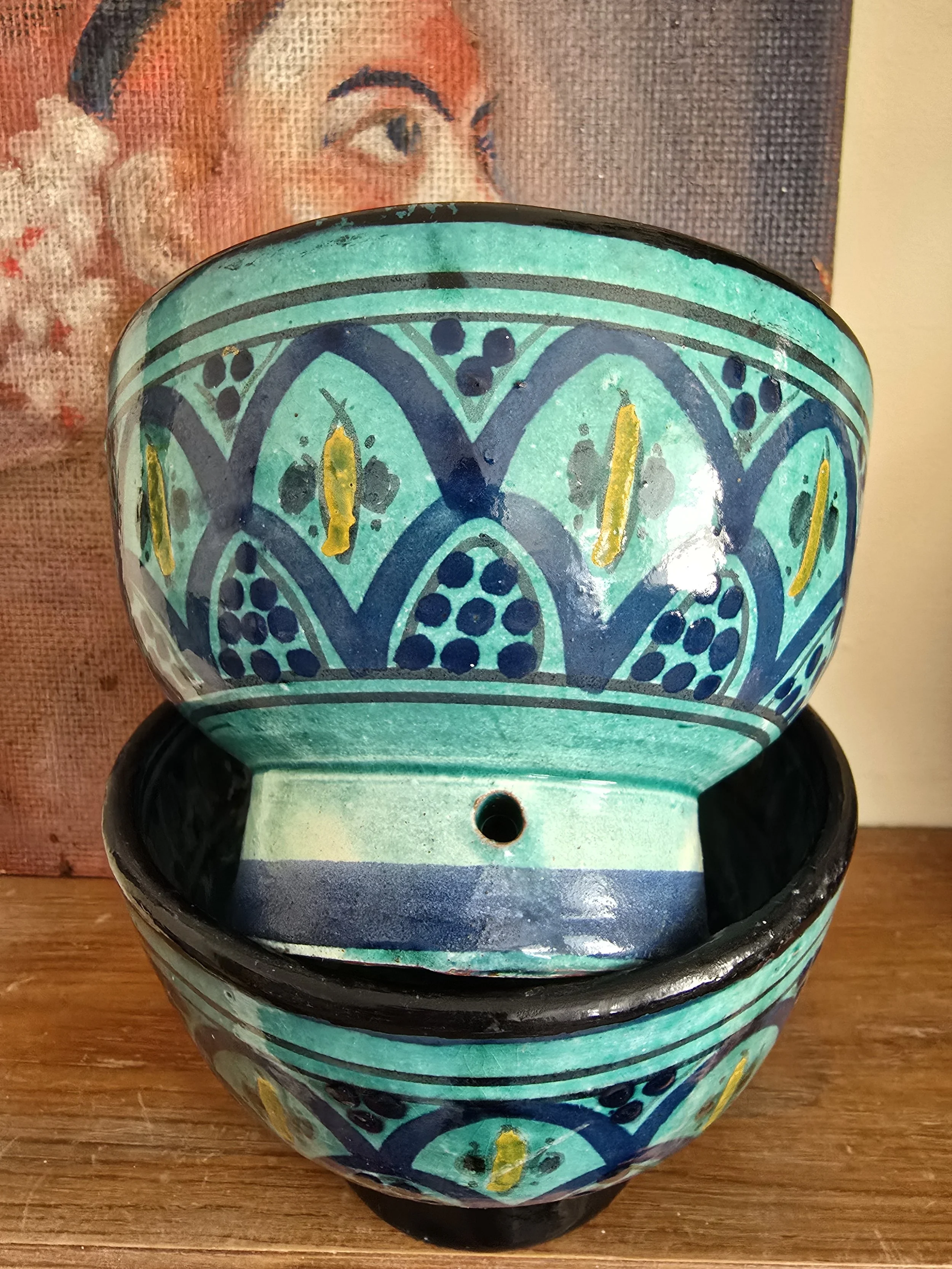 Side profile of stacked Zlafah ceramic bowls showing turquoise and blue North African patterns