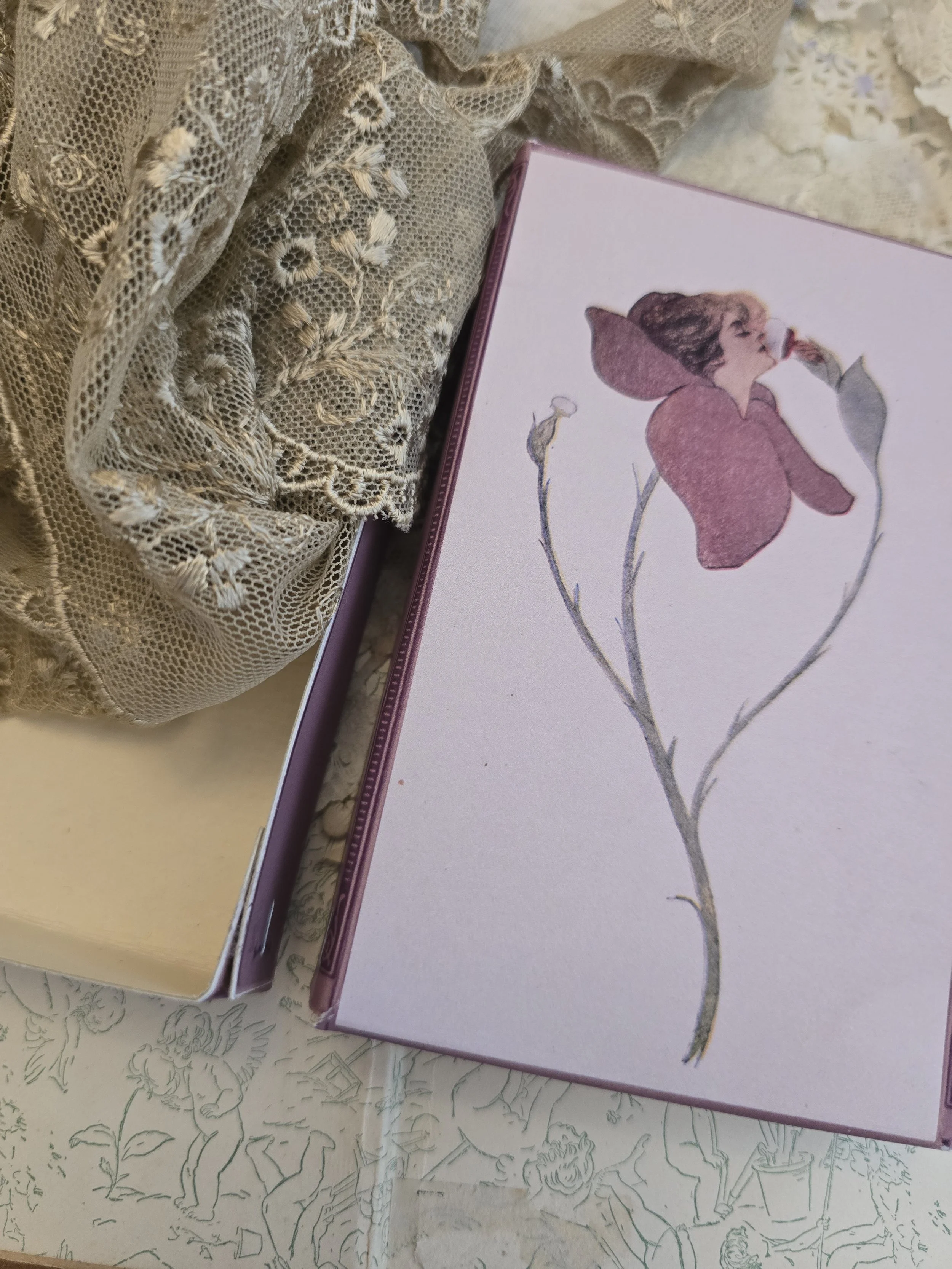 Full view of The Puff Blossom Box, handmade in old French card stock with a pink and mauve antique botanical illustration.