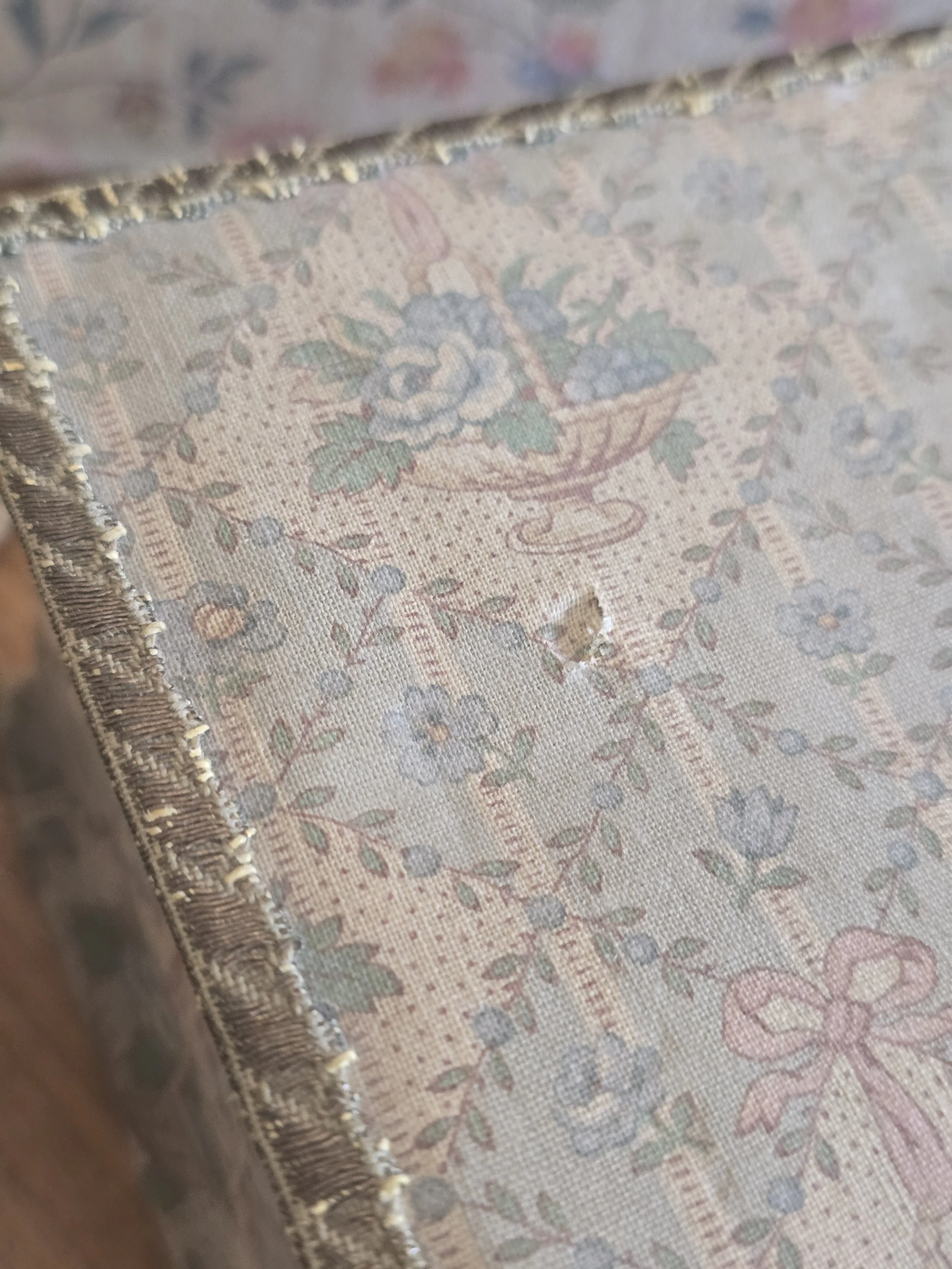 Close-up of original metallic braid edging on antique French floral fabric box.