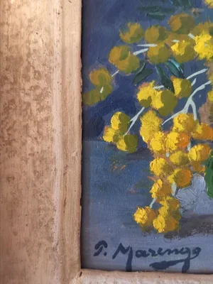 Side angle showing aged wooden frame around floral painting