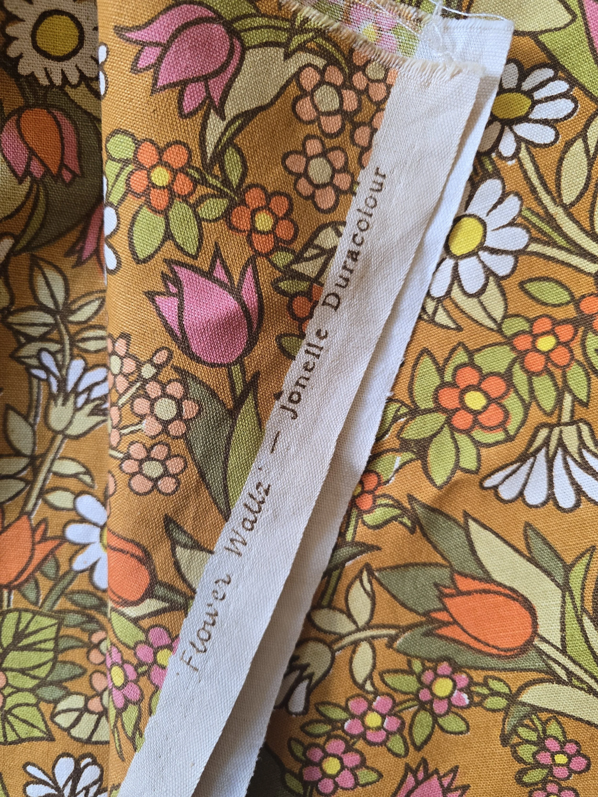 Detail of daisies, tulips and foliage from Jonelle Flower Waltz fabric.