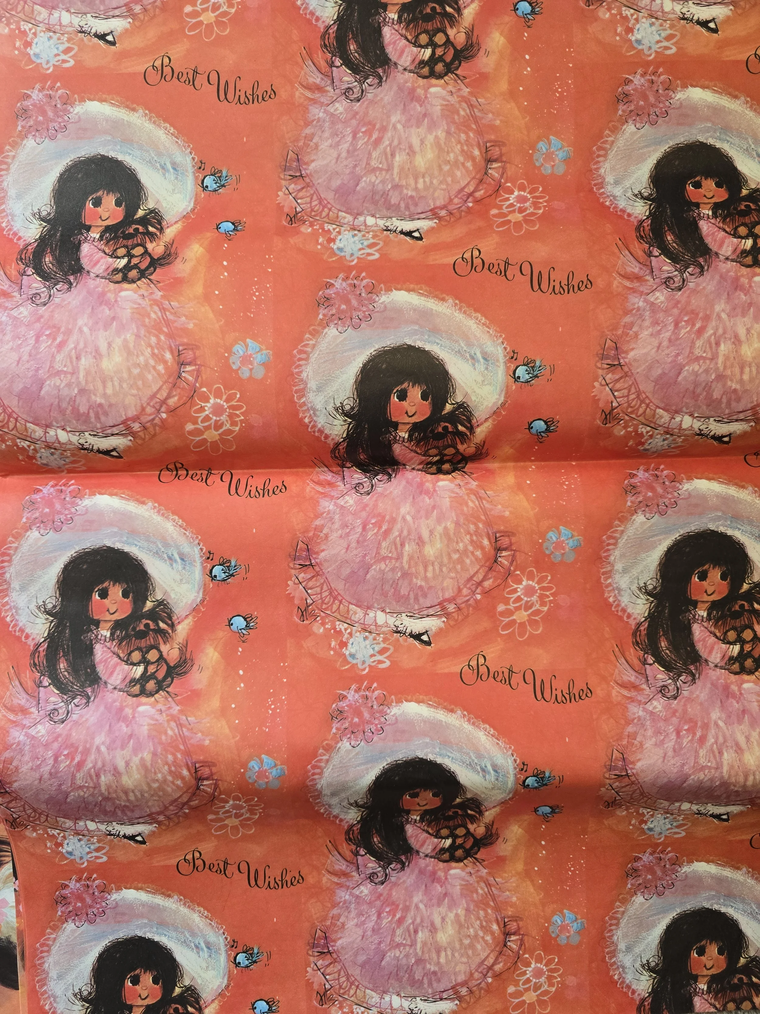 Original 1970s wrapping paper with girl in pink bonnet dress and "Best Wishes" text