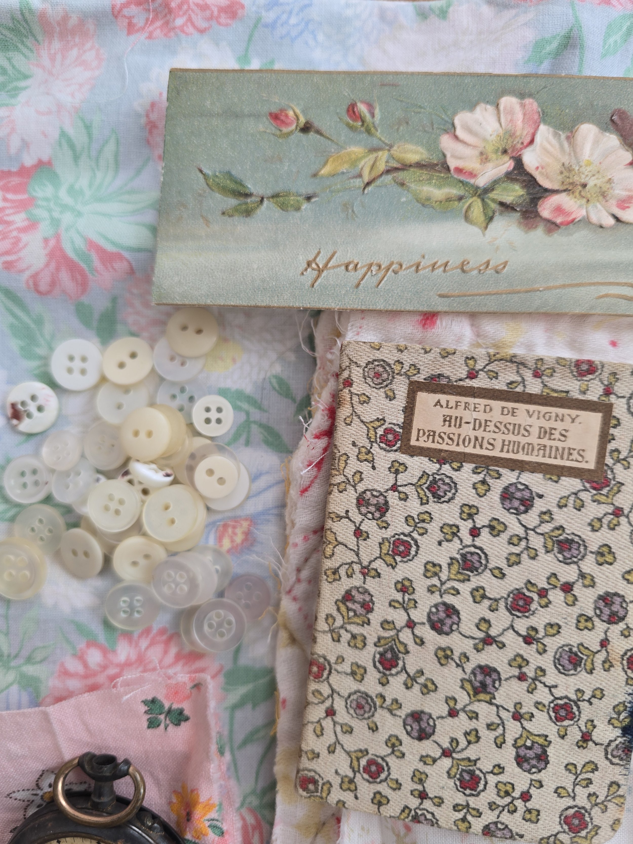 small French fabric covered book with floral pattern and aged texture