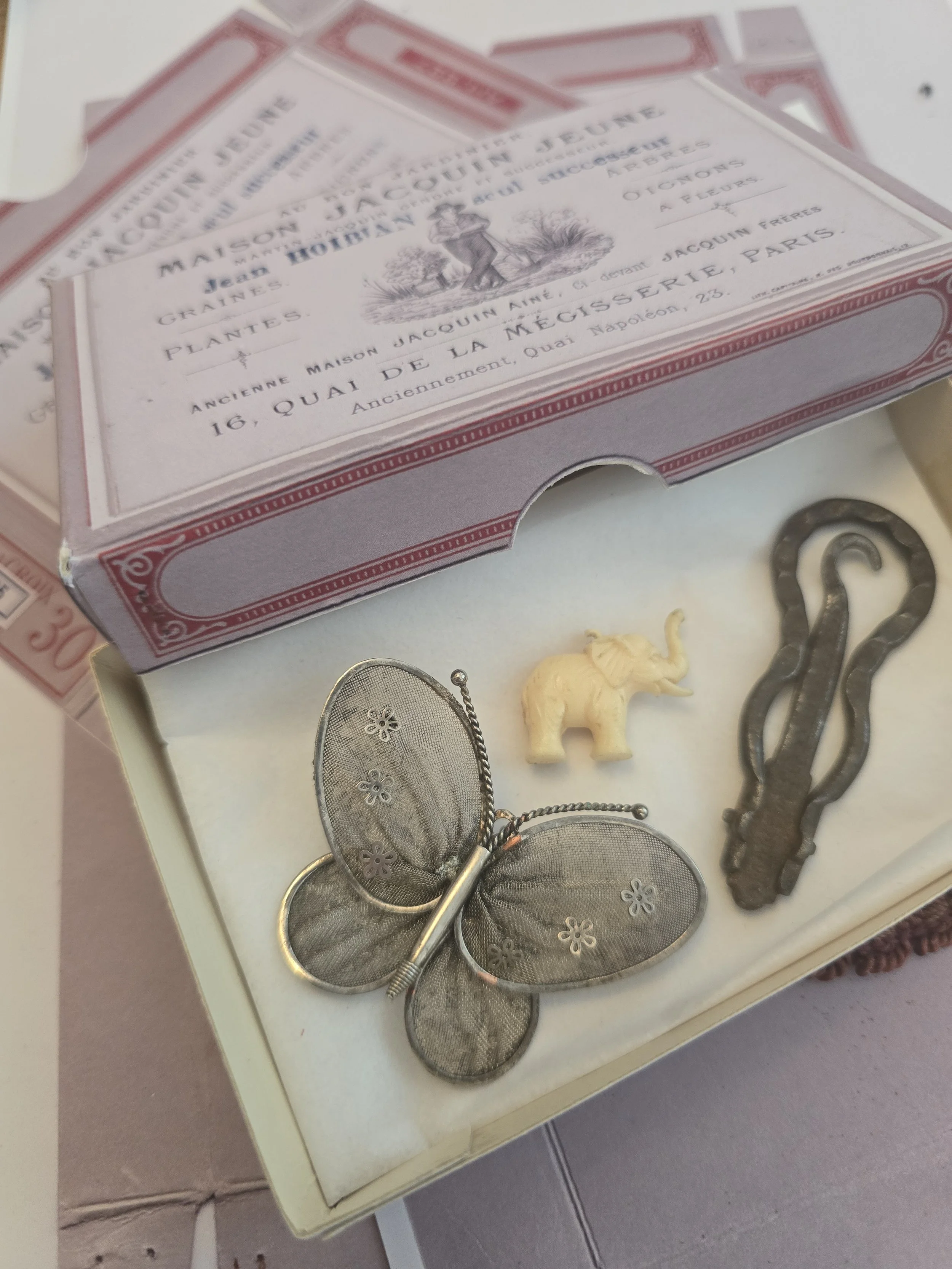 Front view of handmade French seed merchant keepsake box with old Parisian garden and plant merchant typography.