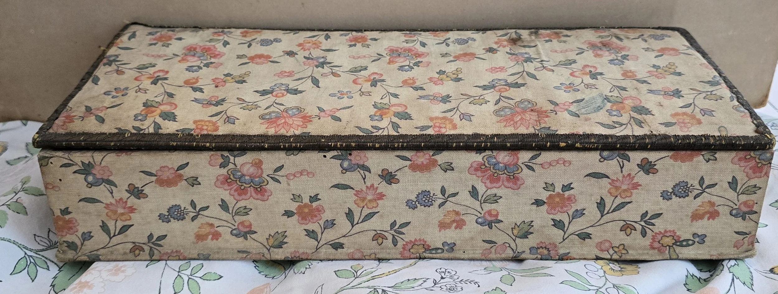 rectangular vintage keepsake box with delicate pink and blue floral fabric