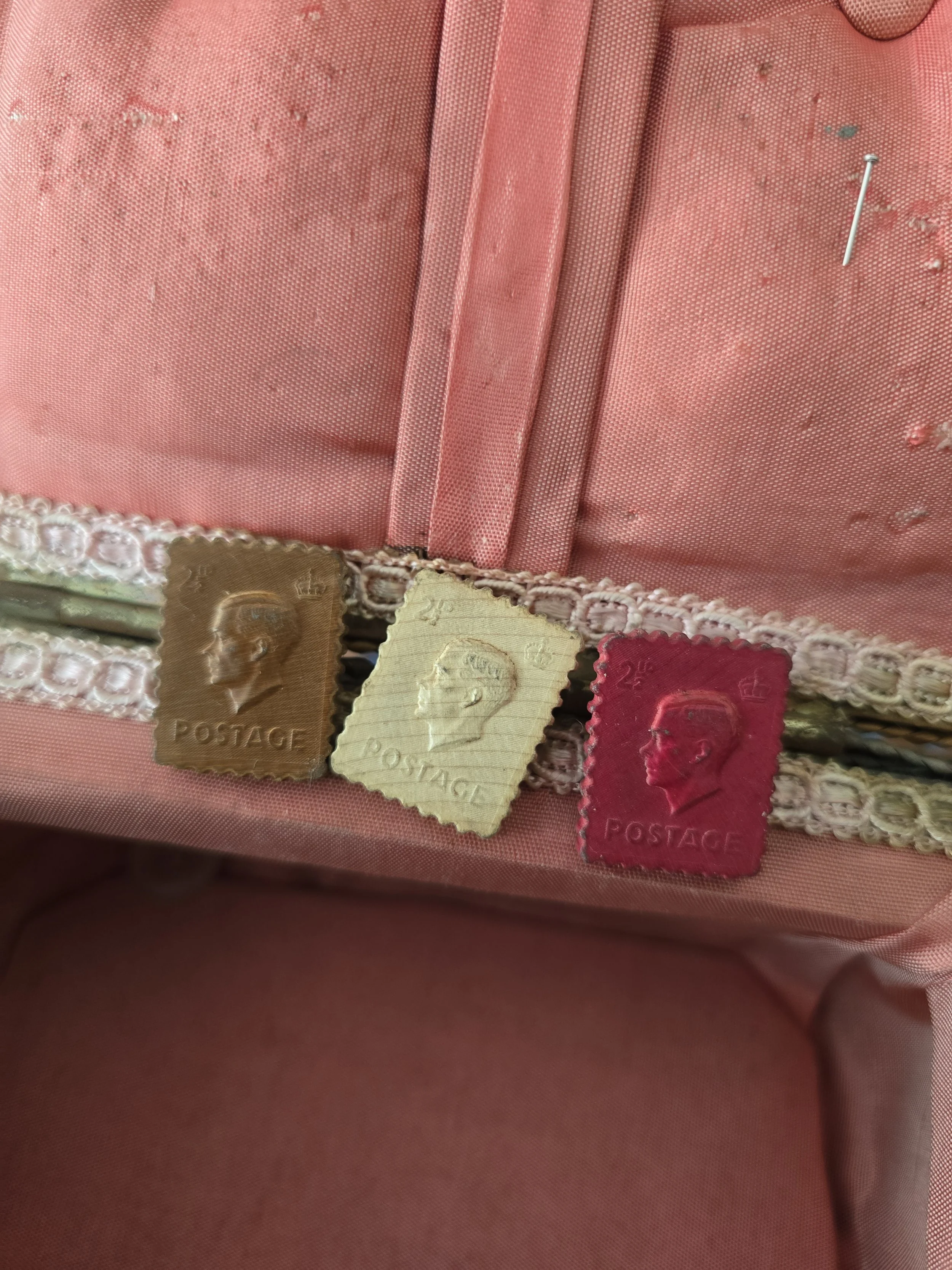 Vintage postage stamp buttons in brown, cream and deep red.