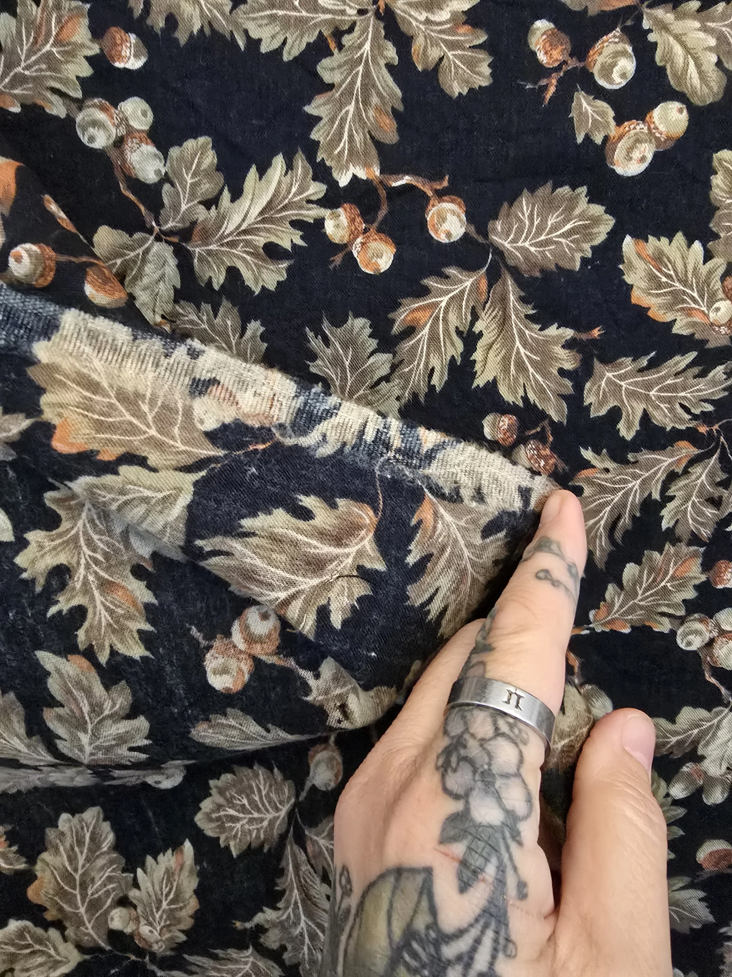 Draped view of vintage oak leaf and acorn fabric showing texture