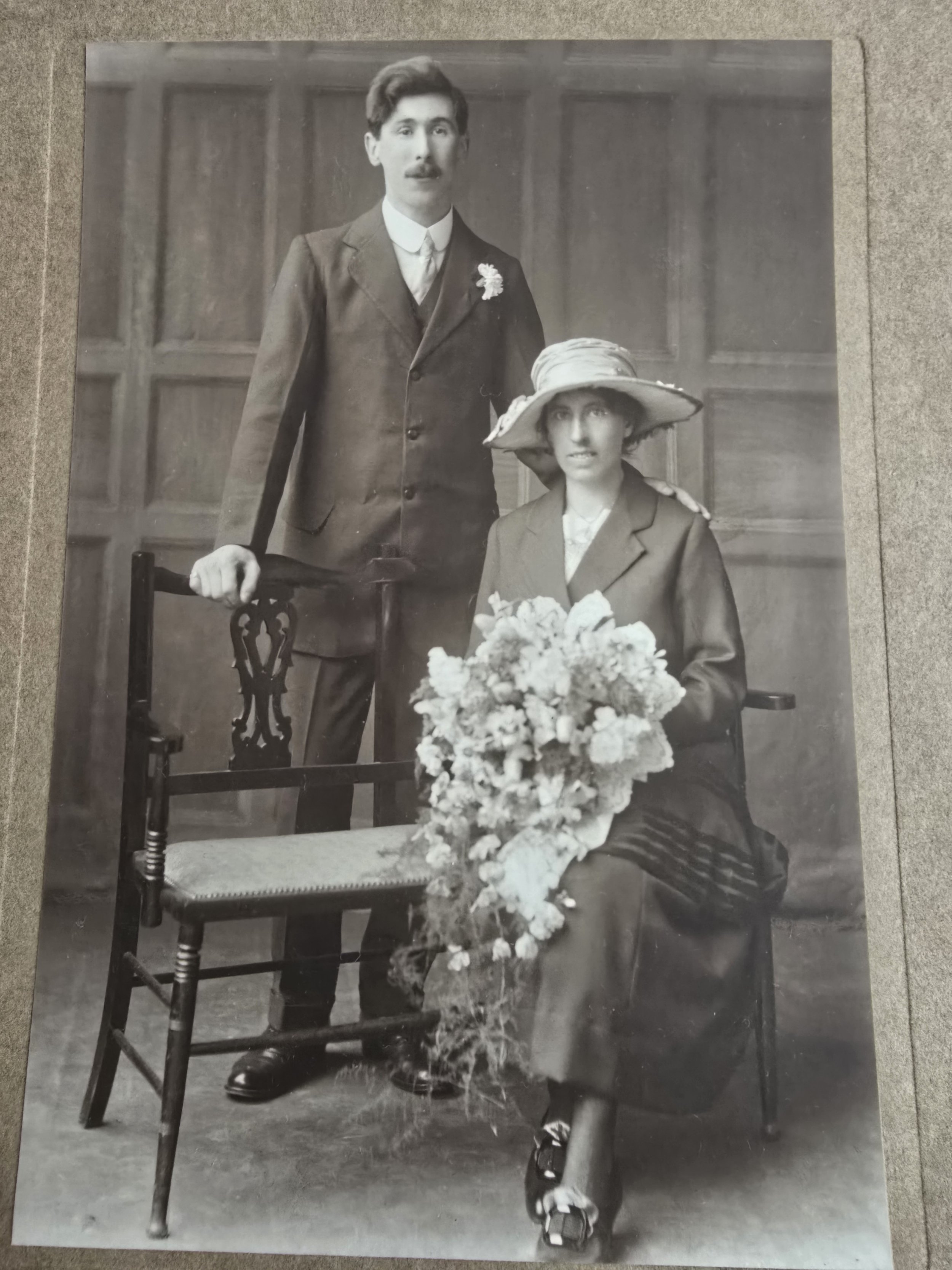 Close-up of bride and groom in sepia-toned vintage wedding photograph