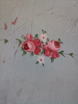 Hand-painted pink roses on pale blue vintage French tray surface