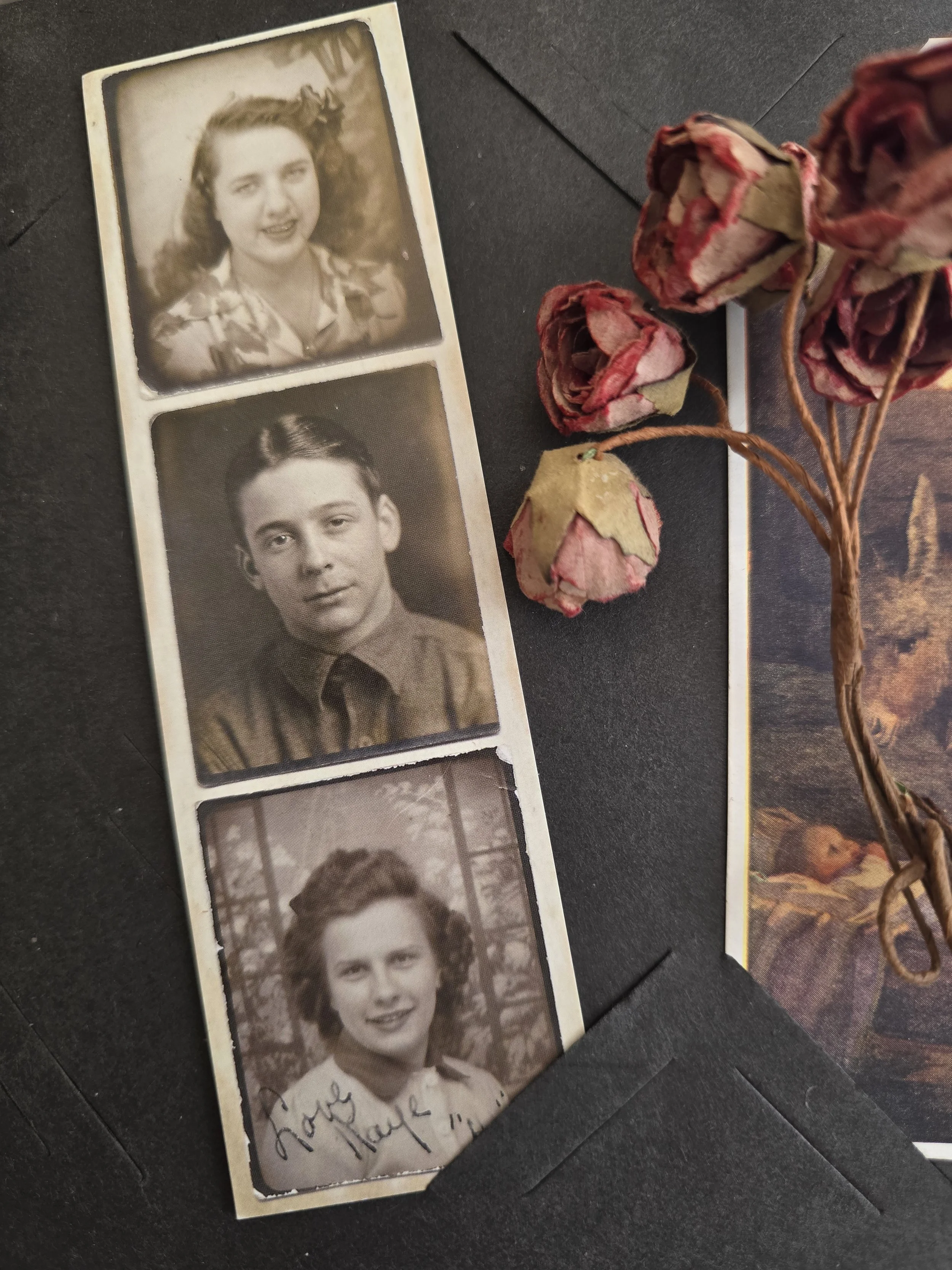 Original 1940s photo booth strip with three black and white portrait photographs.