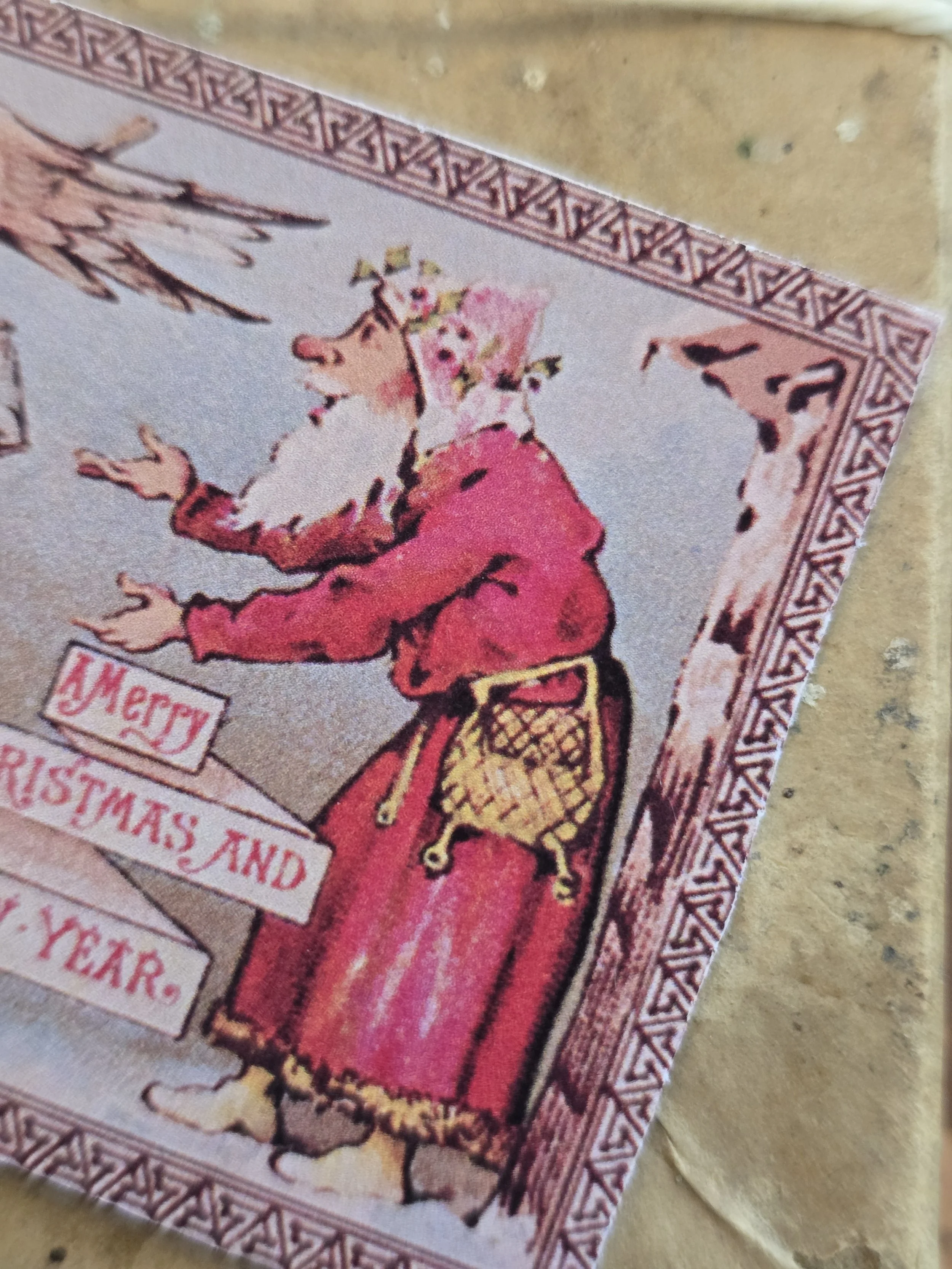 Close-up of Father Christmas in red on a printable tag created from an original antique Christmas card.
