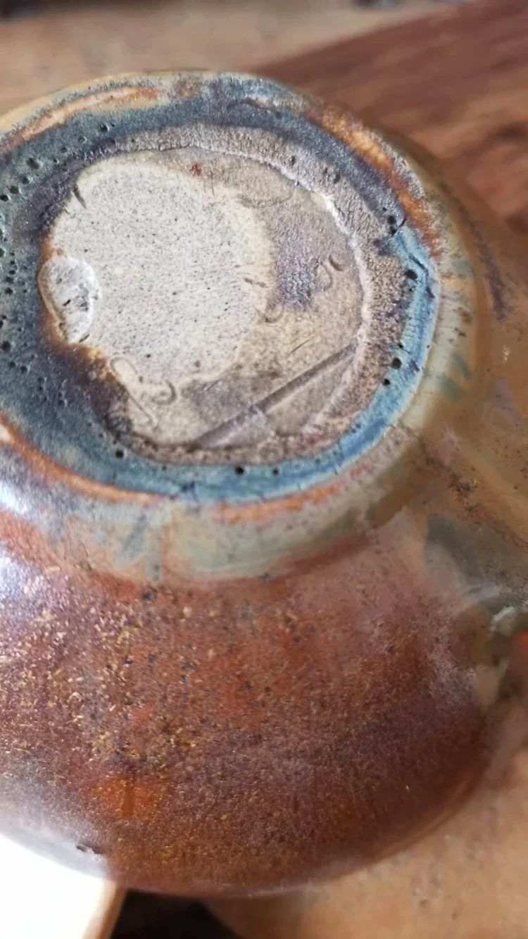 Underside of Charles Greber saucer showing signature and glaze texture