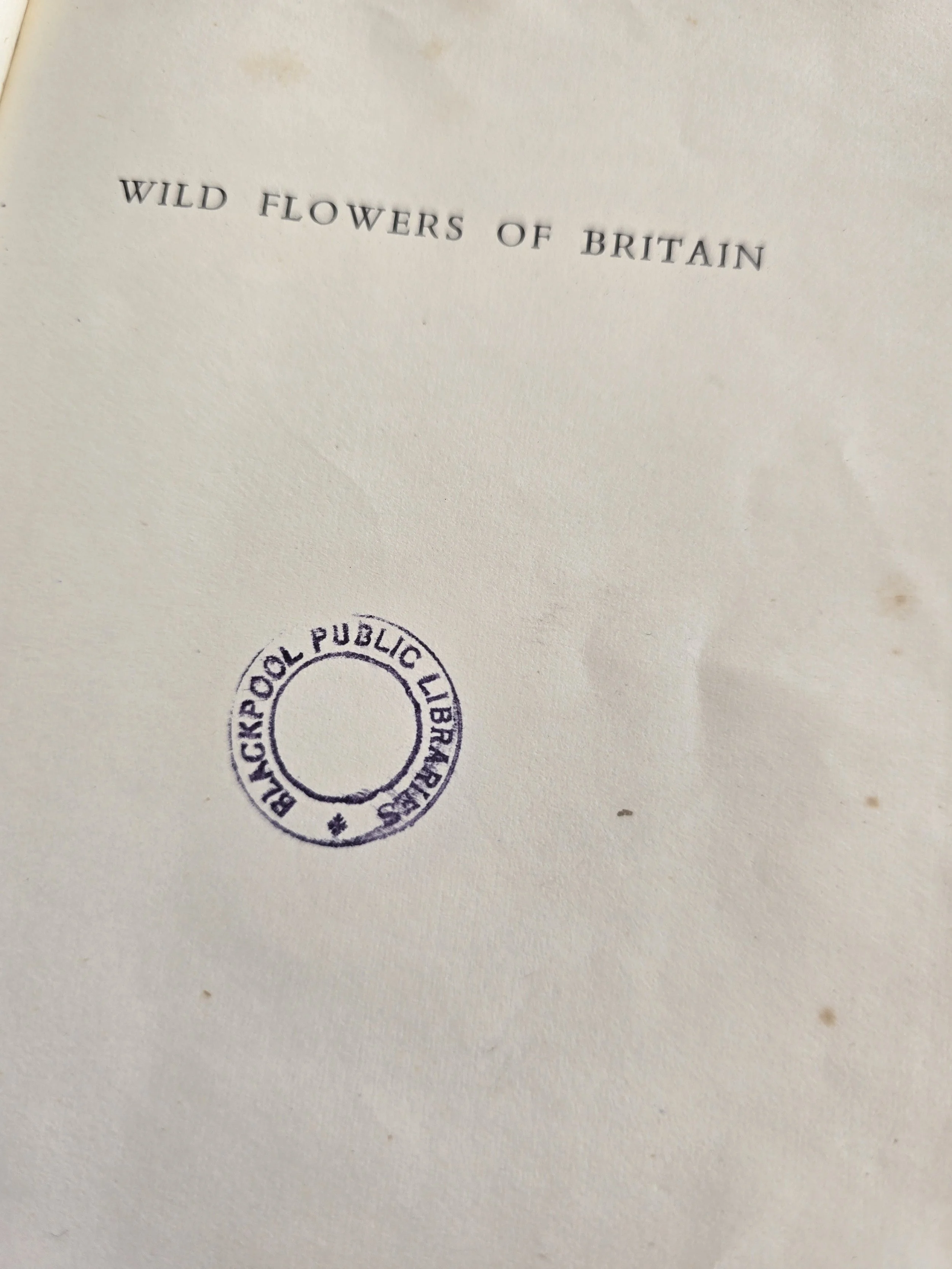 vintage library book lending record pages with handwritten dates and aged paper marks