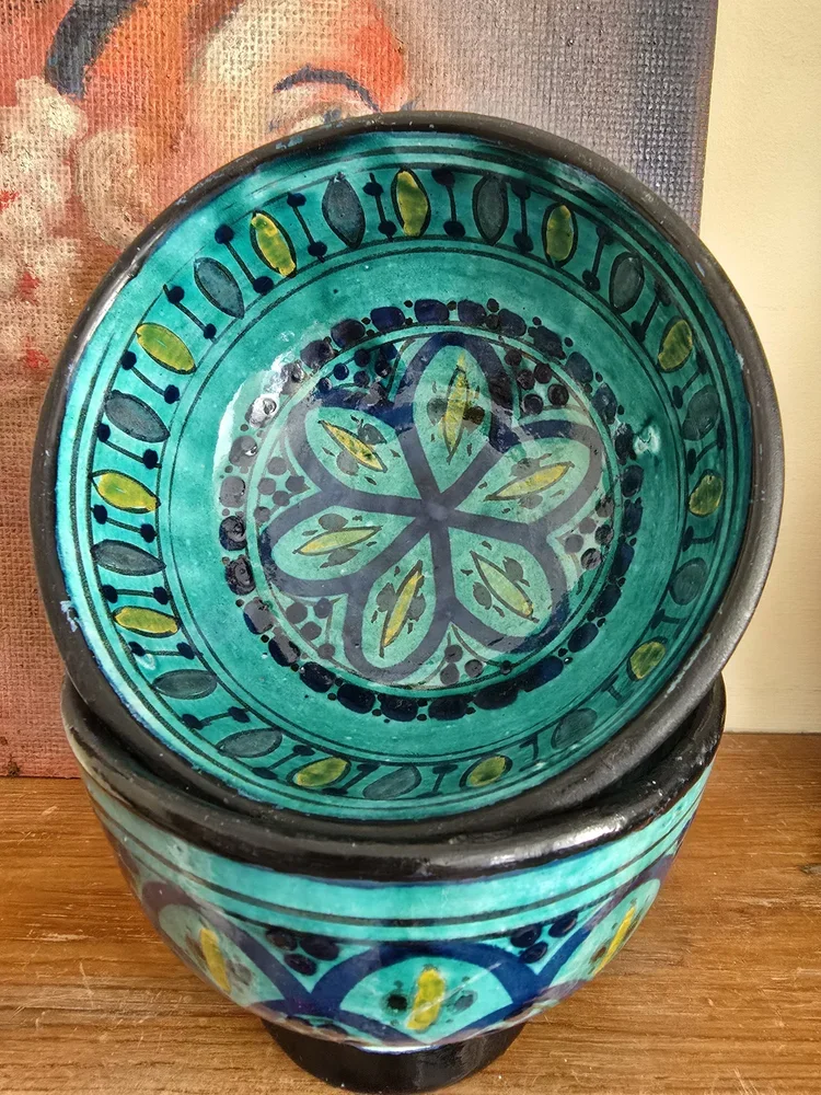 Overhead view of Zlafah bowl interior with floral medallion design in turquoise a