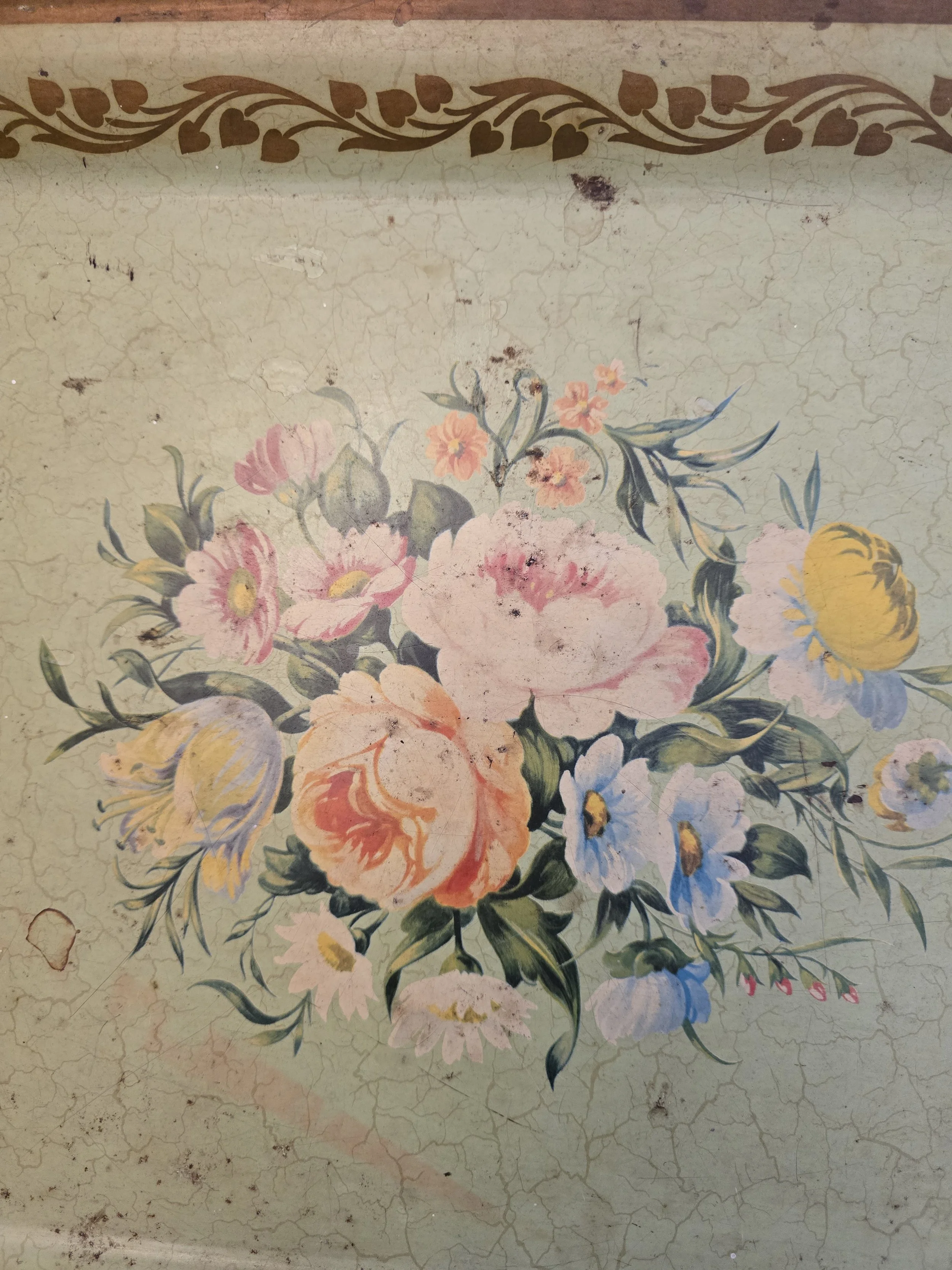 Close-up of faded painted flowers on vintage Worcester Ware folding tray with crackled finish and patina. (Copy)