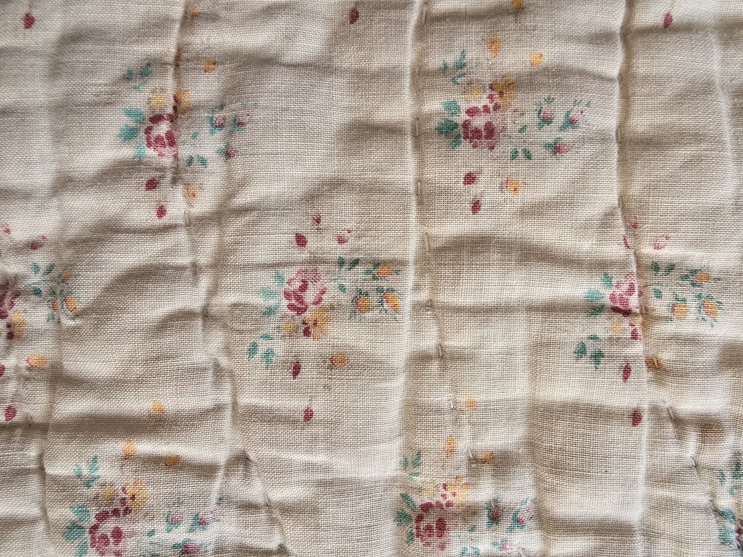 Bold floral front side of vintage quilted textile