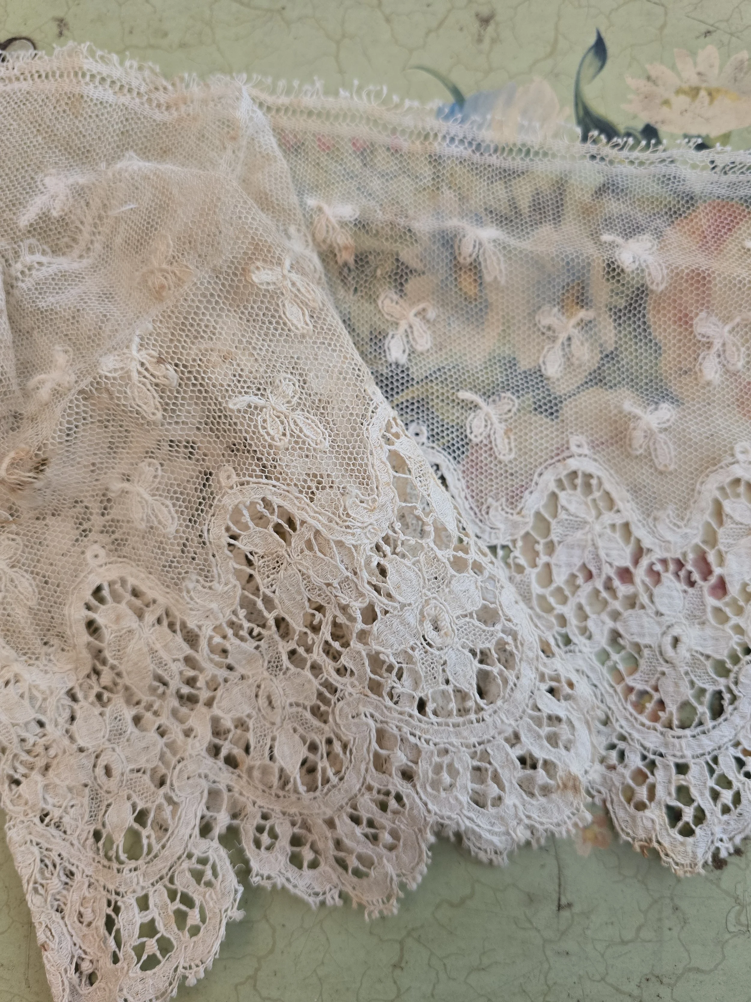 Soft aged lace trim suitable for textile art and slow stitching