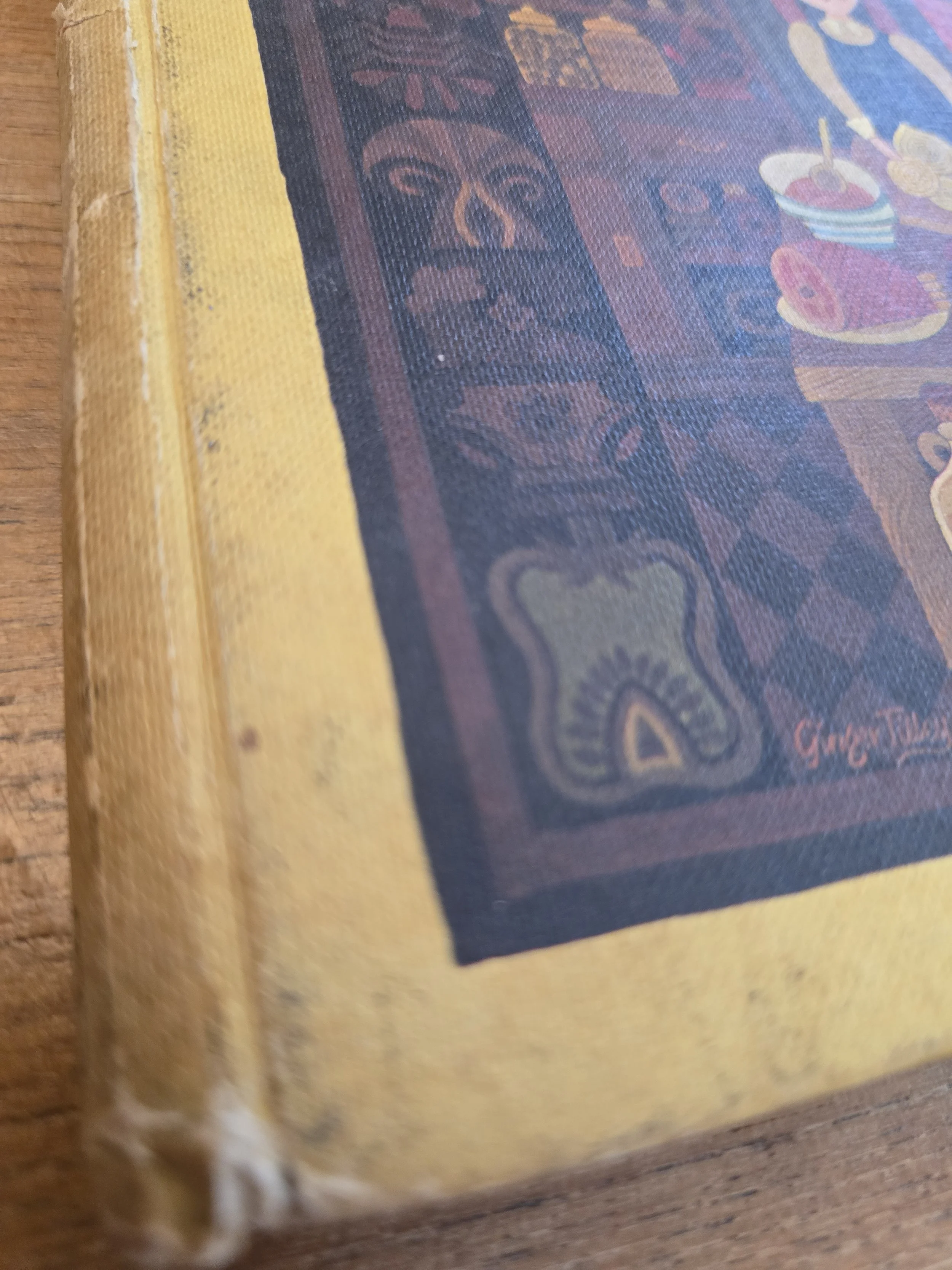 Detail showing wear and damage to the spine and binding of the book.