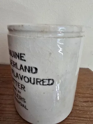 close-up of "Miller's of Kendal" printed stoneware crock