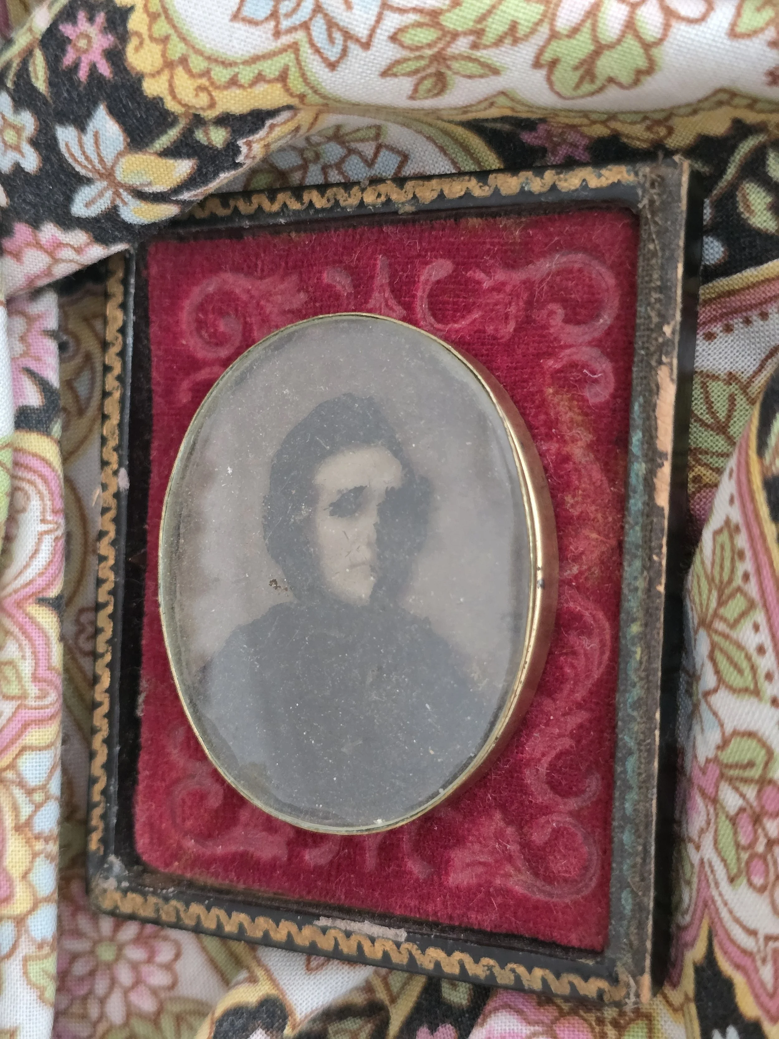 Original brass mat surrounding a Victorian gentleman's tintype
