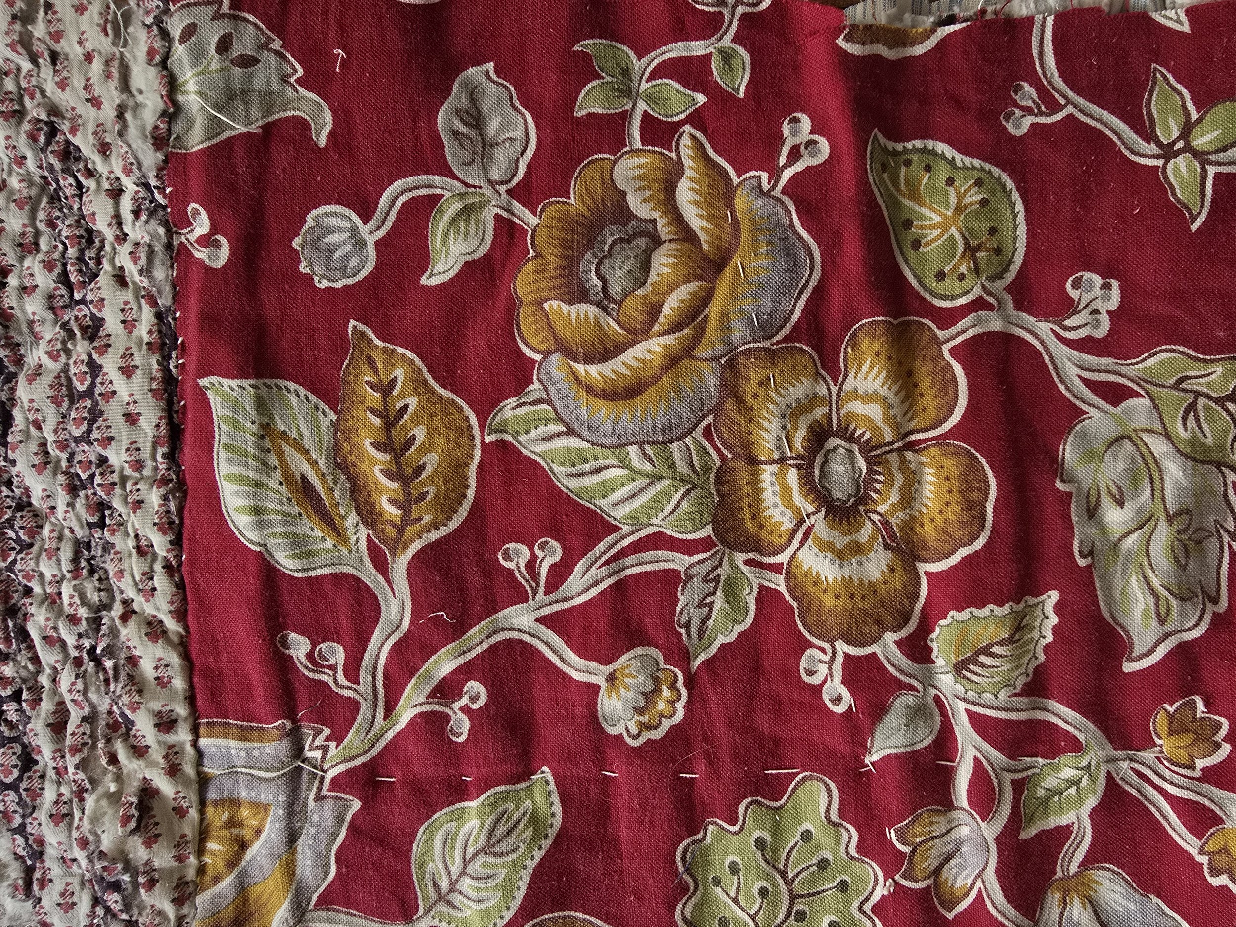 Antique French quilt with madder red floral and scrolling vines