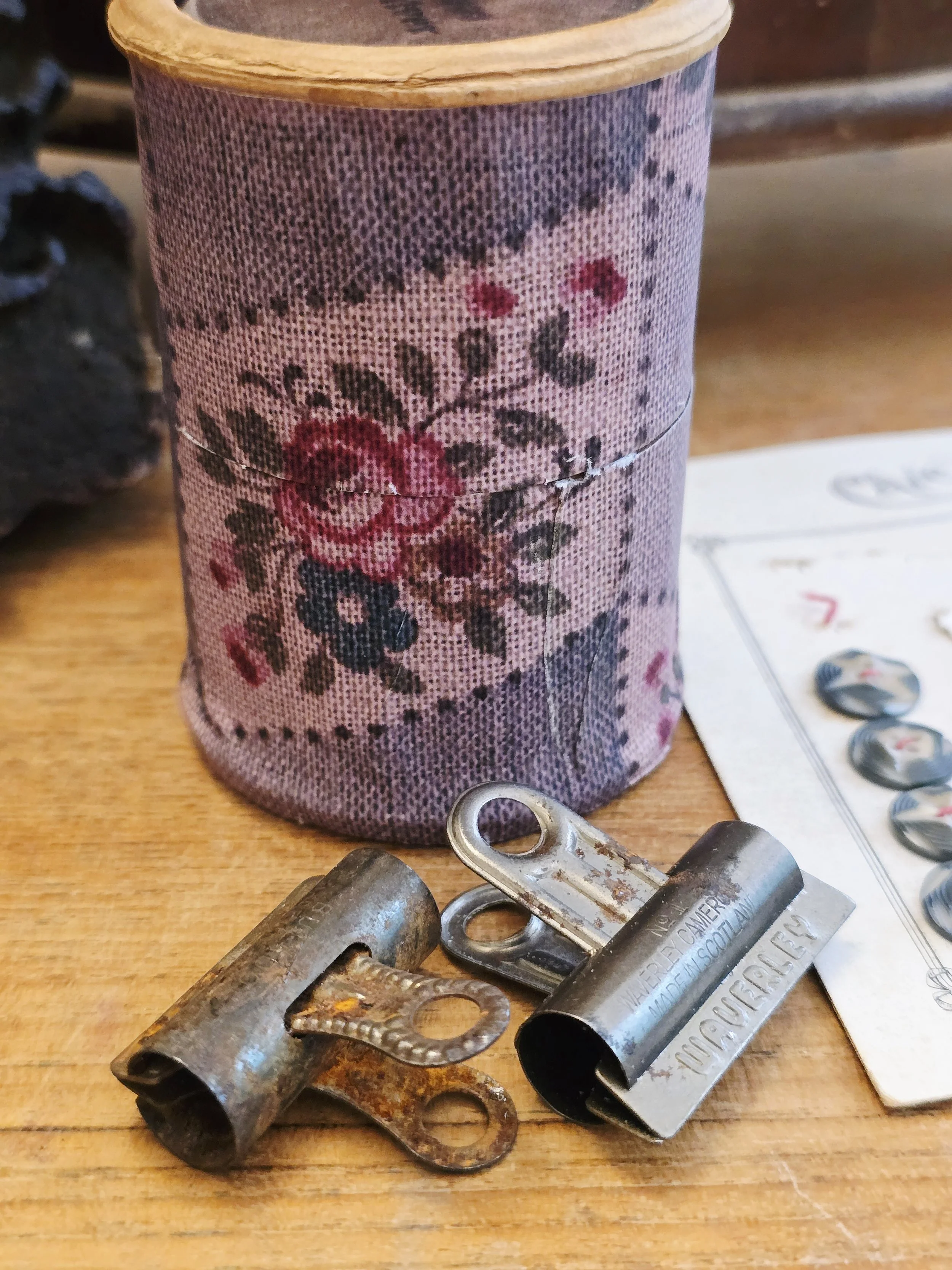 Close-up of reproduced antique French textile pattern on an old cardboard box