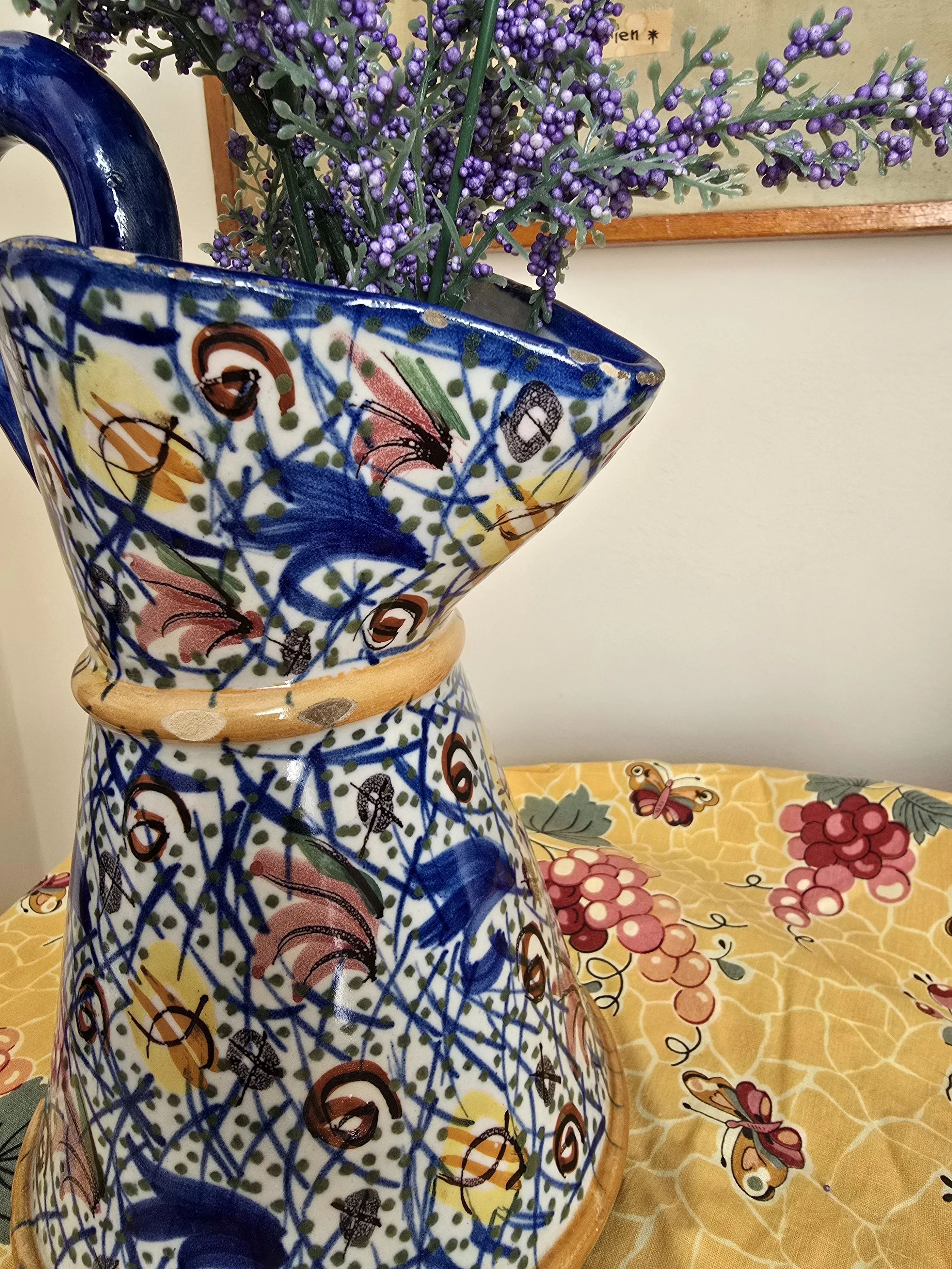 Ceramic pitcher styled with lavender stems inside